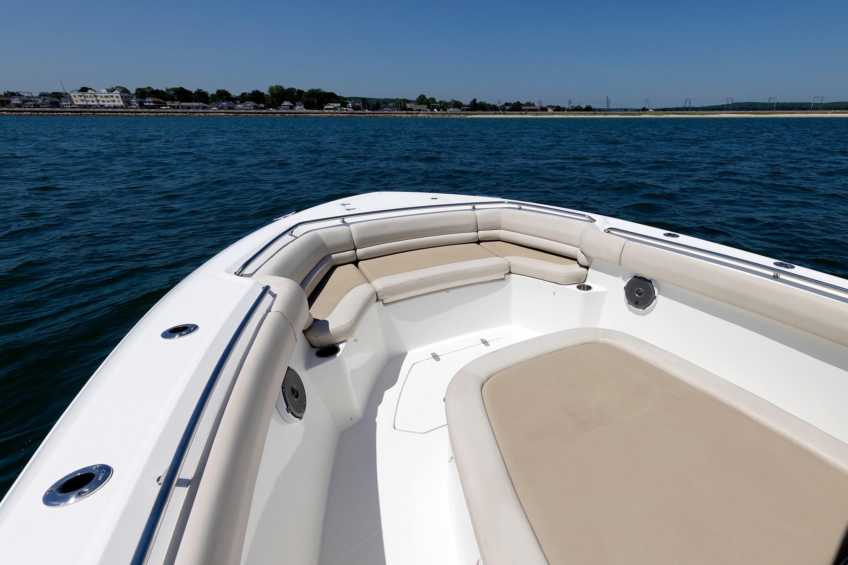 2016 Boston Whaler 330 Outrage boat with spacious seating on calm water.