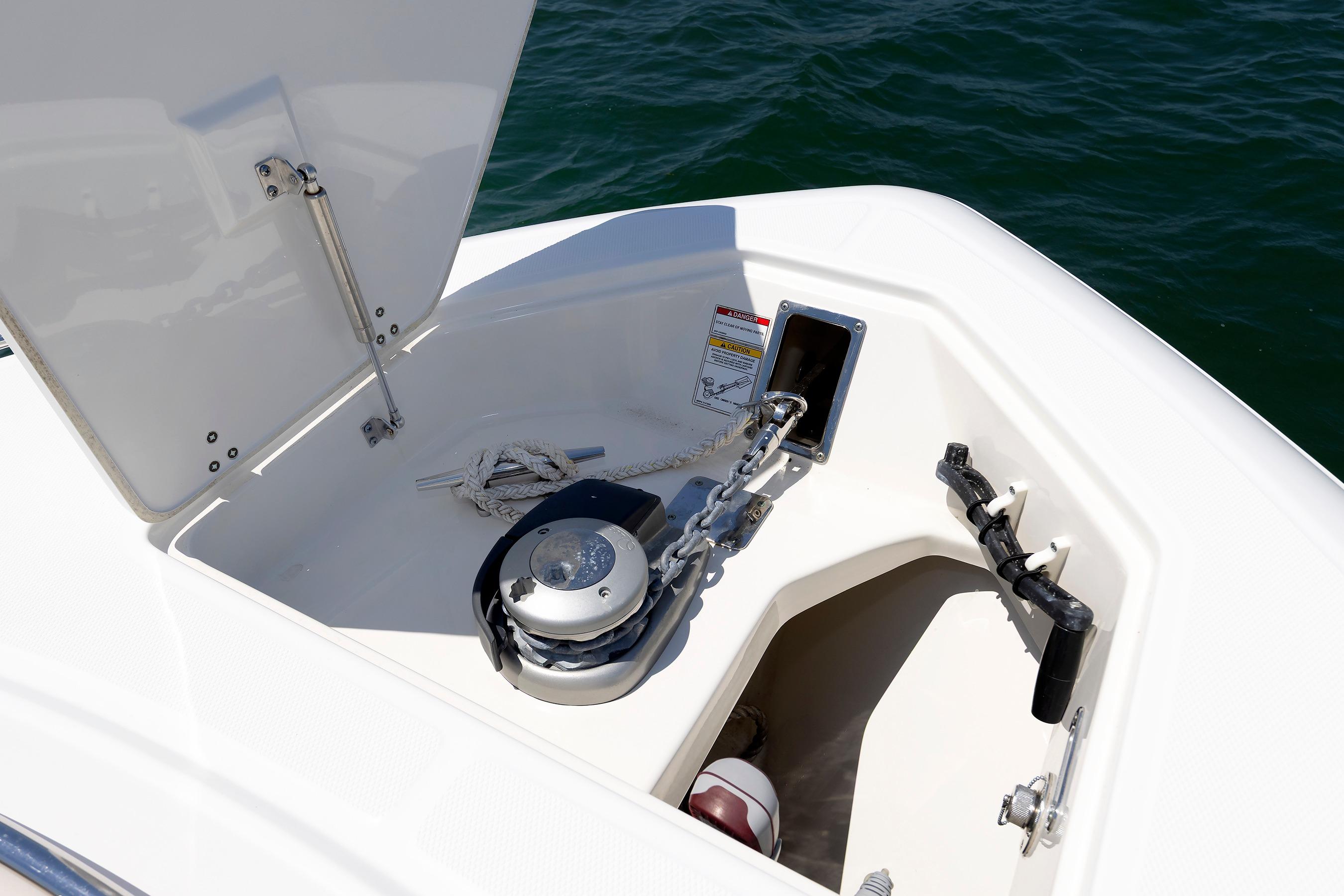 Anchor compartment of 2016 Boston Whaler 330 Outrage boat with chain and rope.