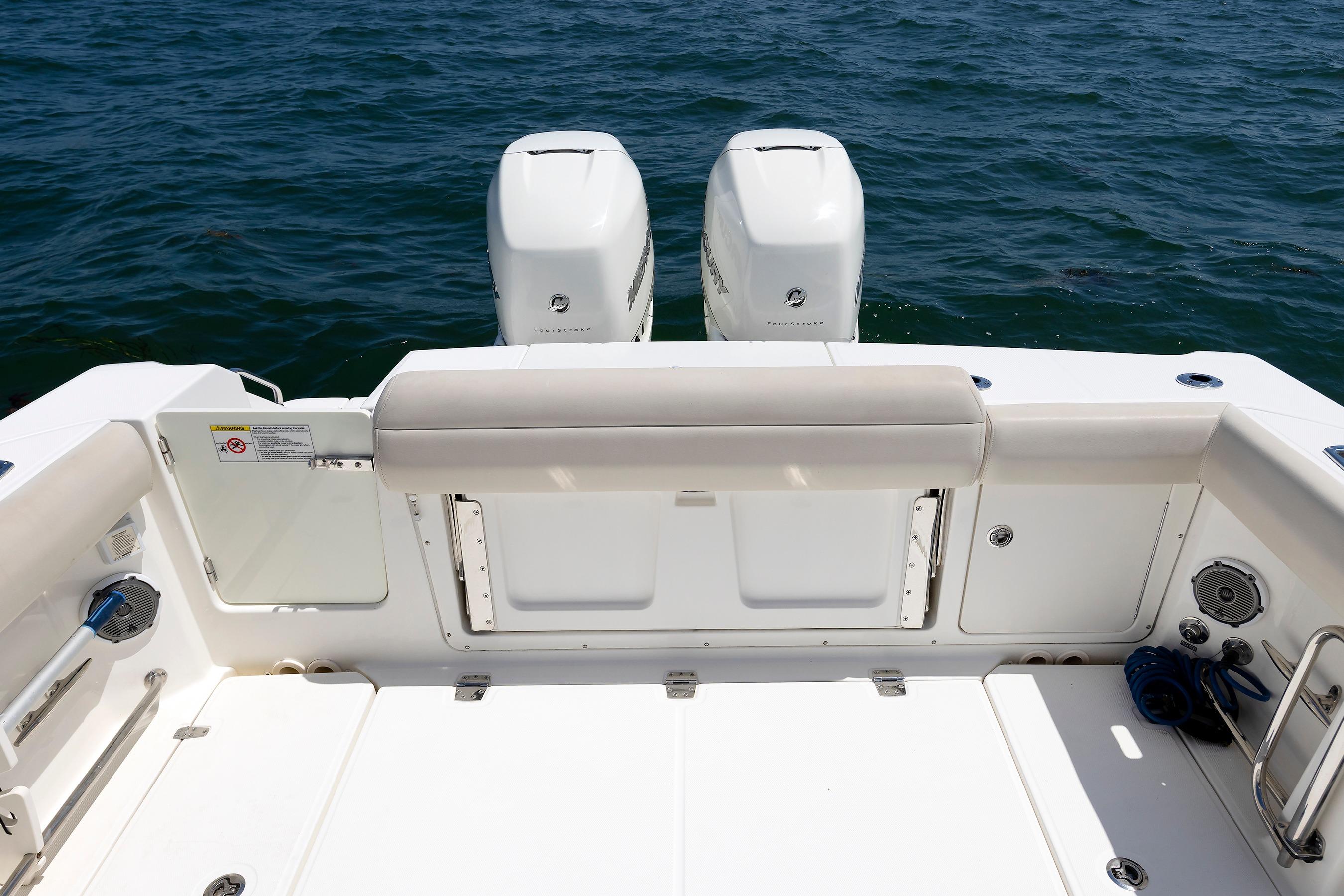 Boston Whaler 330 Outrage 2016 boat deck with twin engines on open water.