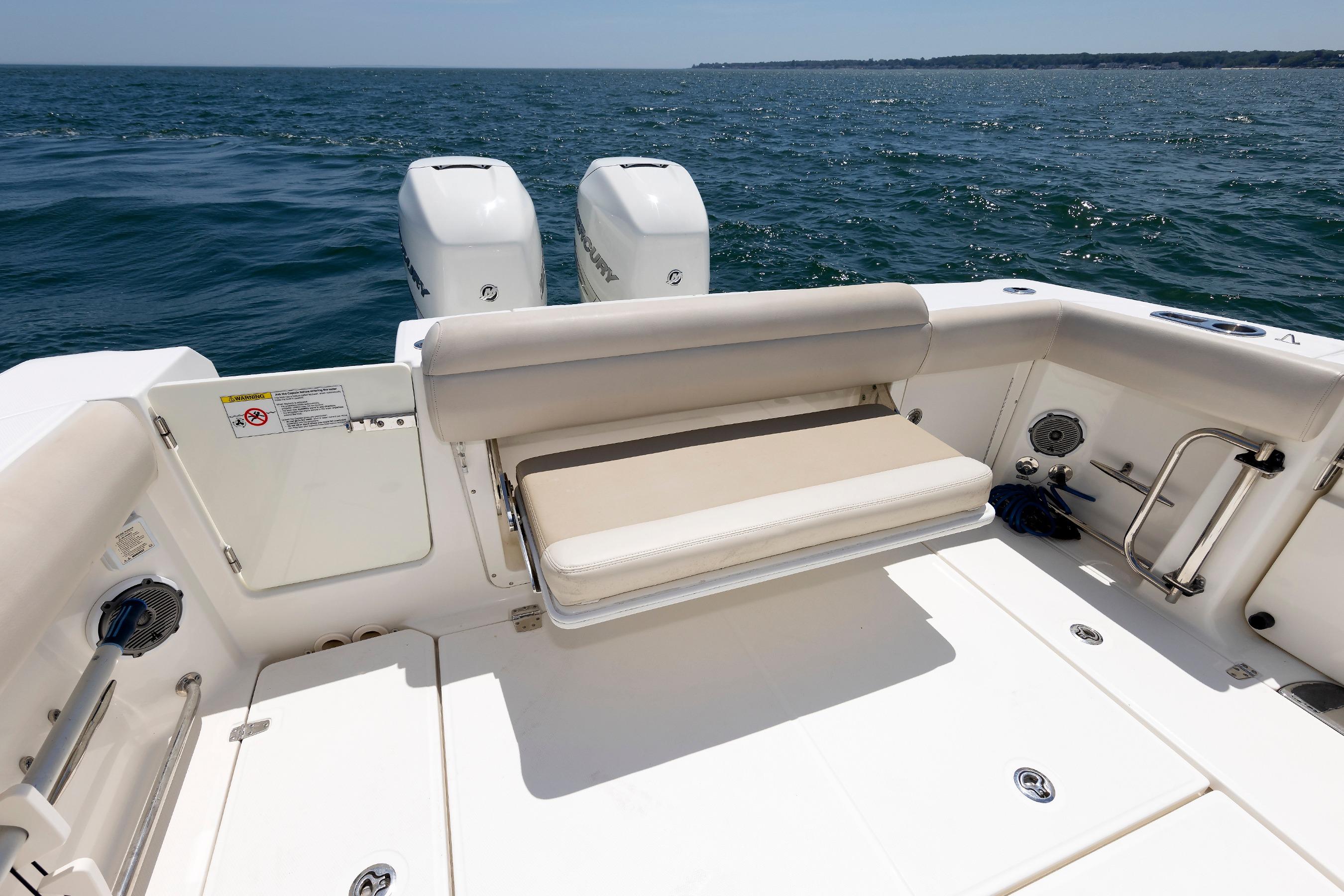 2016 Boston Whaler 330 Outrage boat with dual engines and seating, on open water.