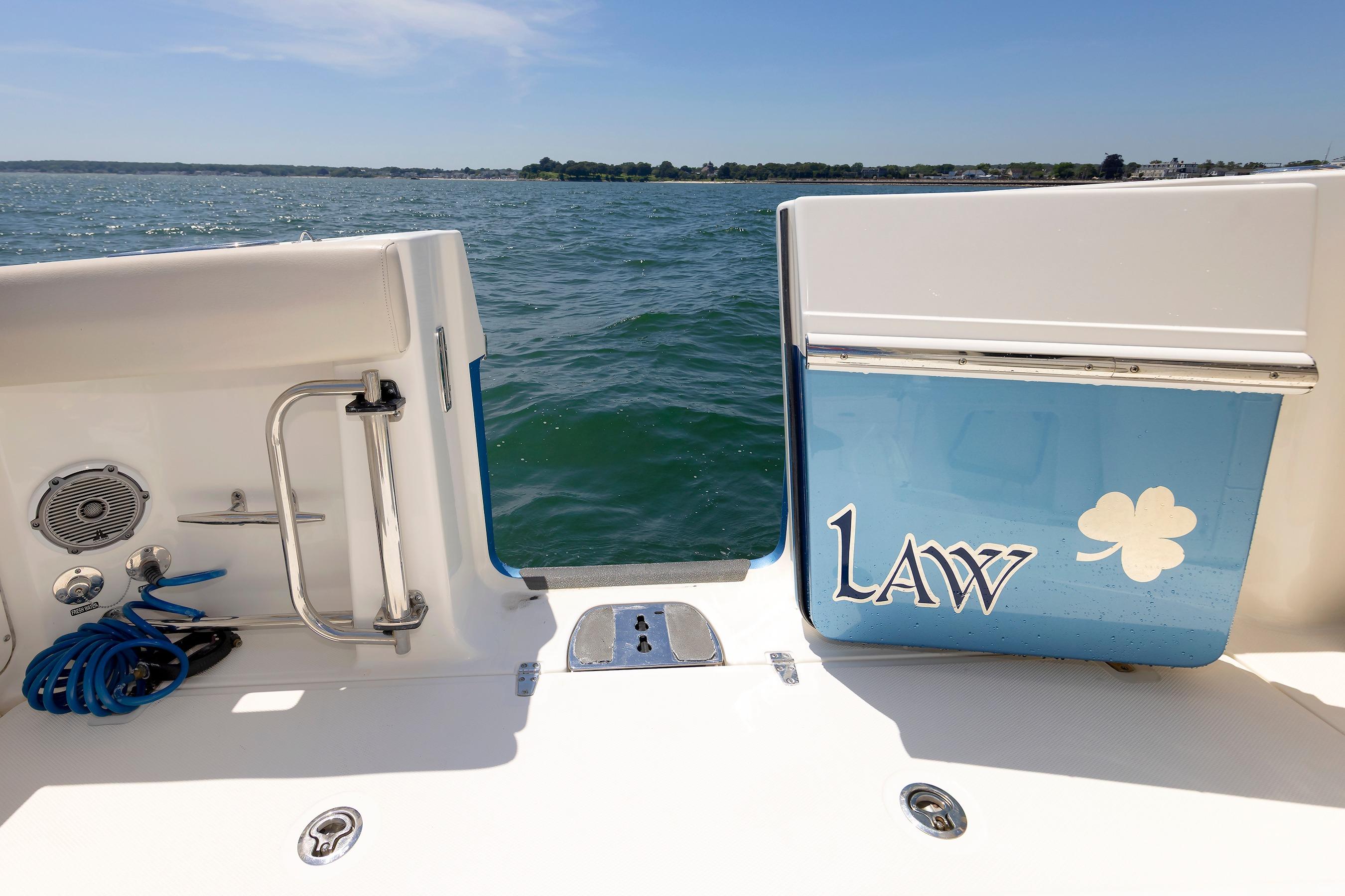 Boston Whaler 330 Outrage 2016 boat deck with ocean view and custom graphics.