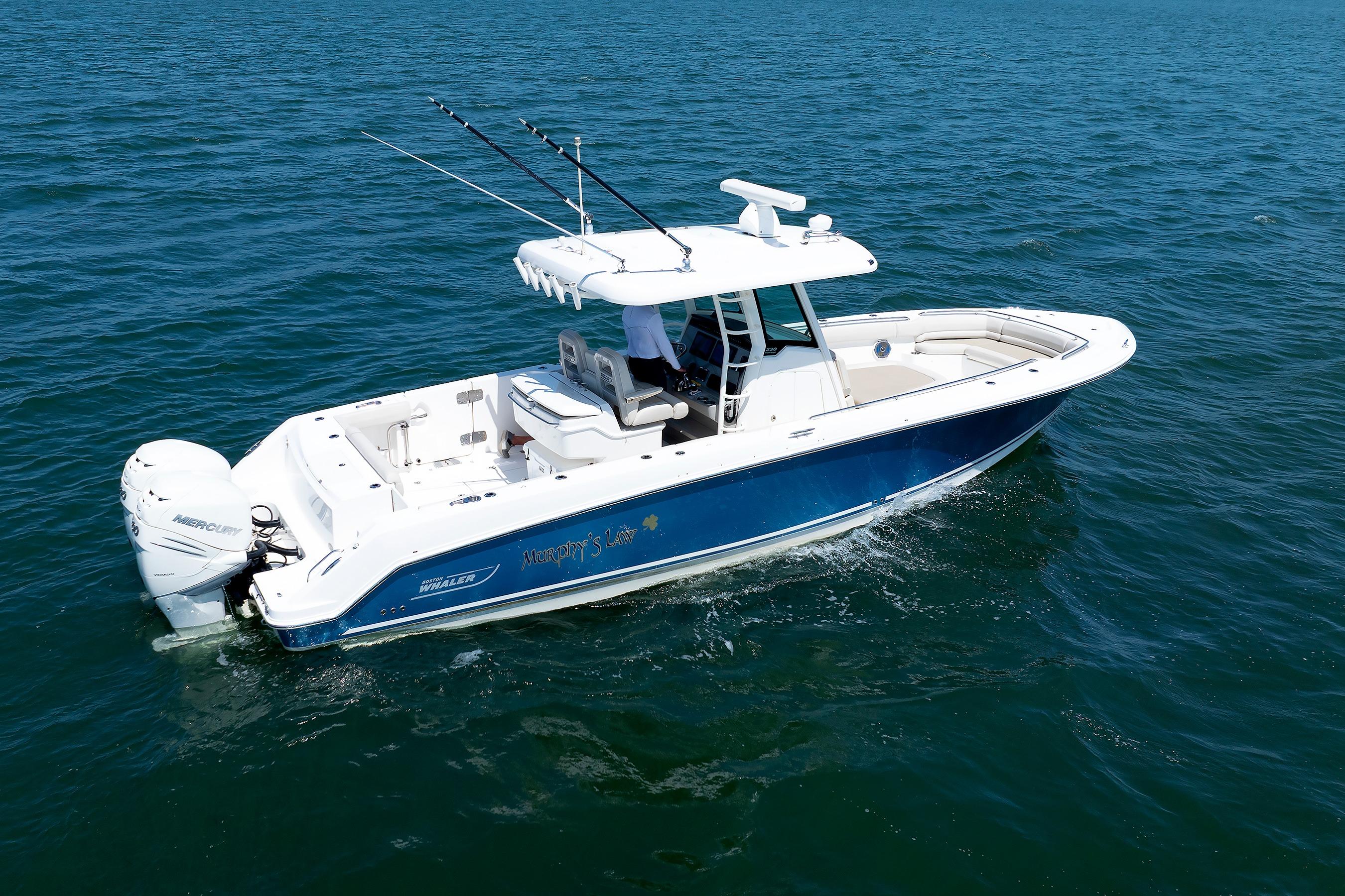2016 Boston Whaler 330 Outrage boat cruising on open water.