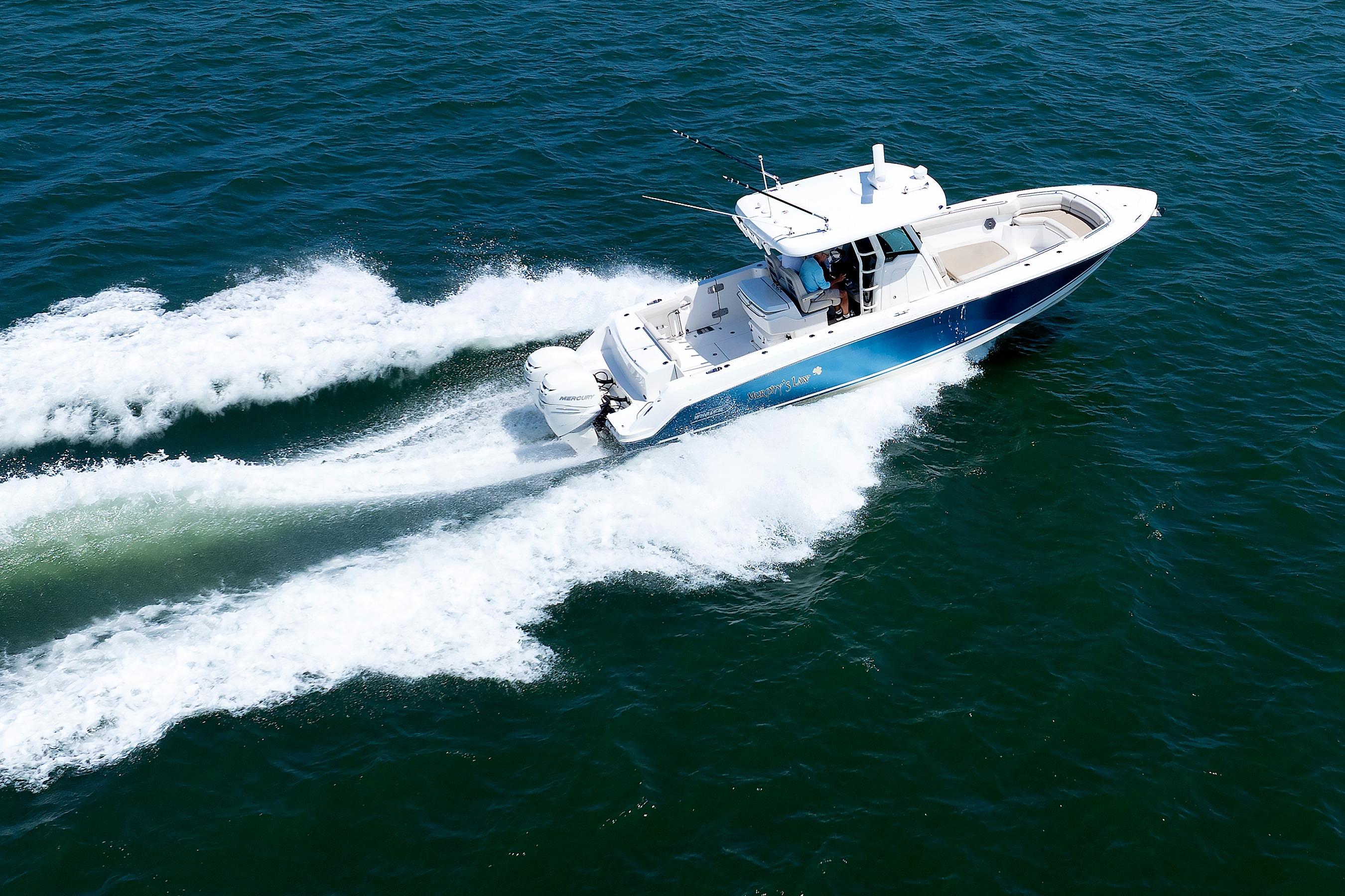 Boston Whaler 330 Outrage 2016 cruising swiftly on open water.