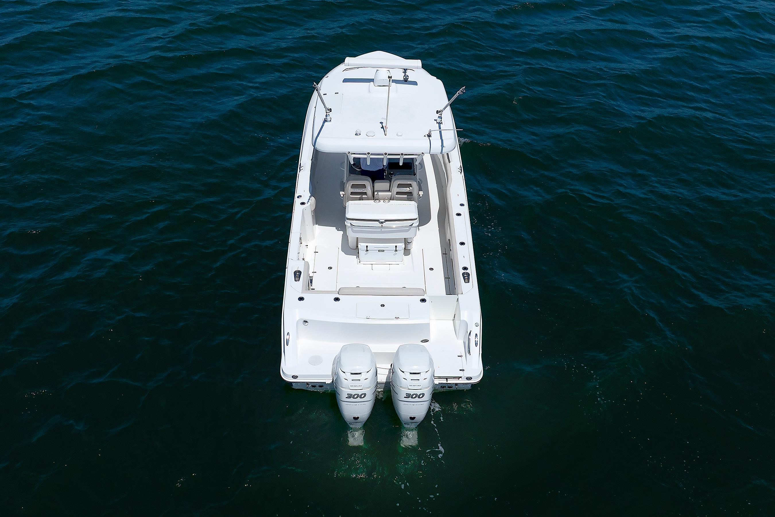 2016 Boston Whaler 330 Outrage boat on open water, aerial view.