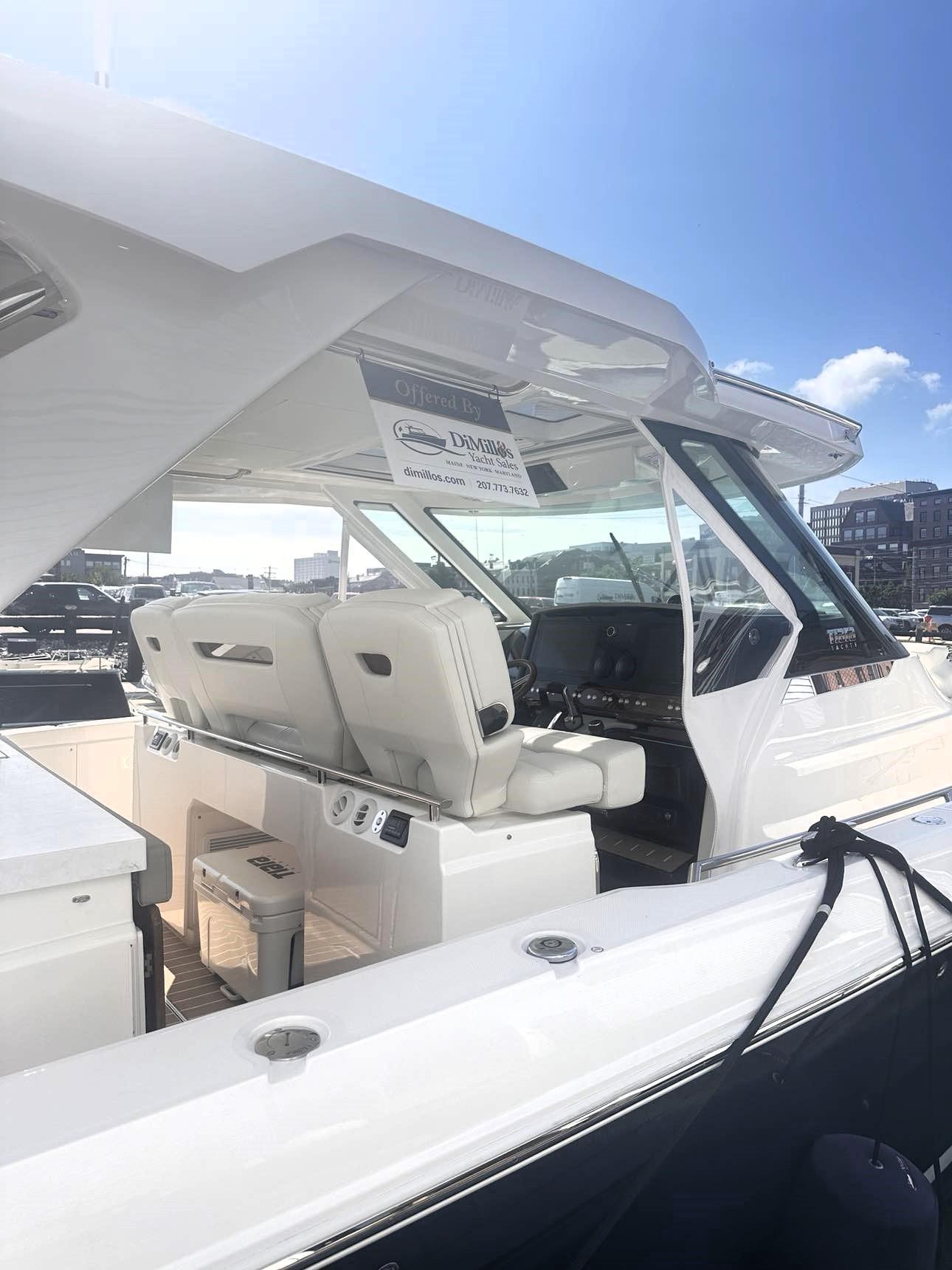 2024 Tiara Yachts 43 LS interior with luxurious seating and modern dashboard.