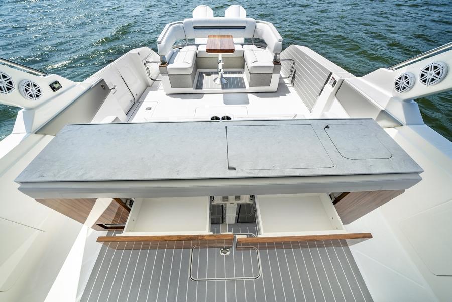 2024 Tiara Yachts 43 LS luxury yacht deck with seating and table on the water.