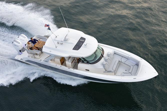 2024 Tiara Yachts 43 LS cruising on open water, showcasing sleek design and luxury features.