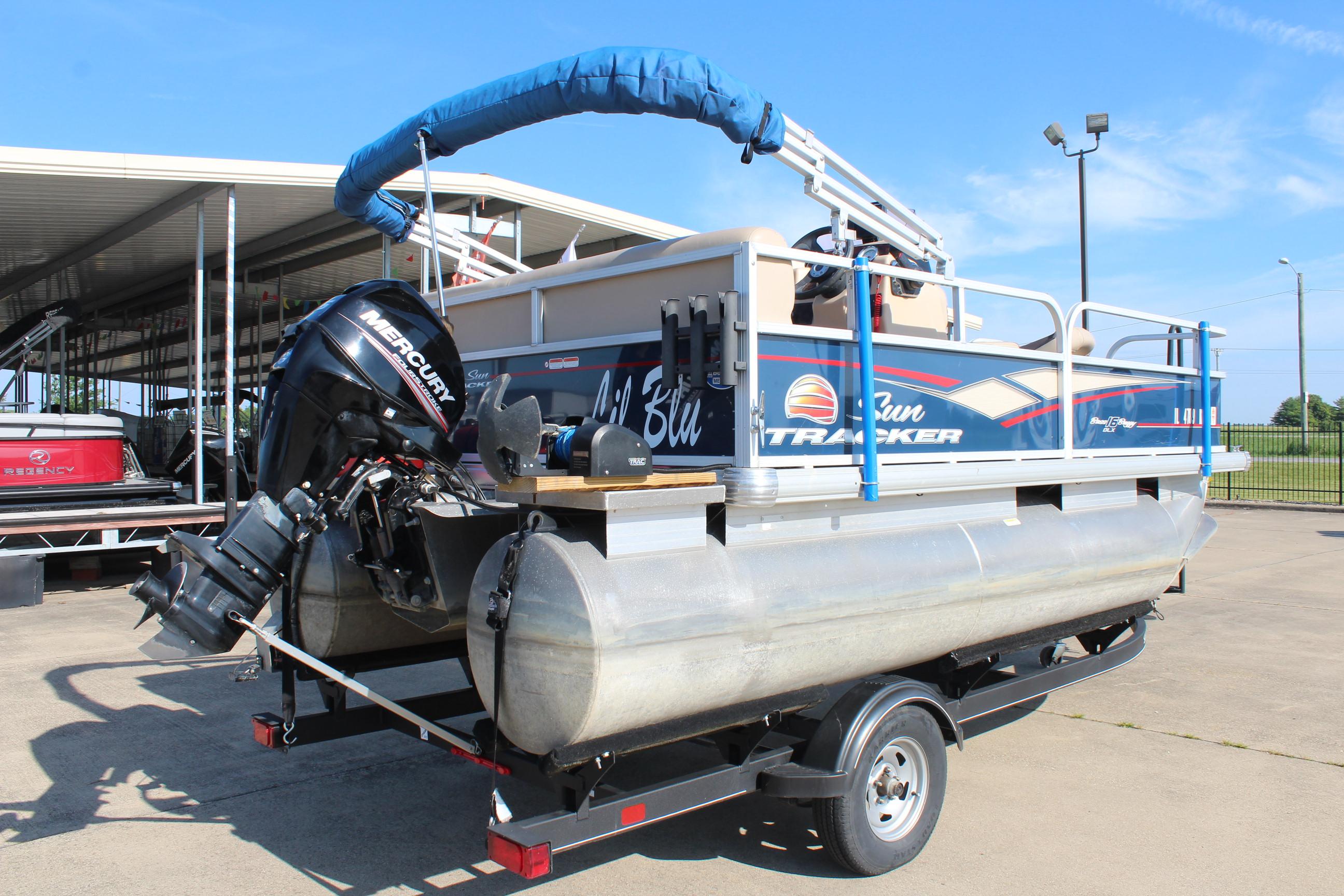 2019 Sun Tracker Bass Buggy 16 XL Select pontoon boat on trailer, with Mercury outboard motor.