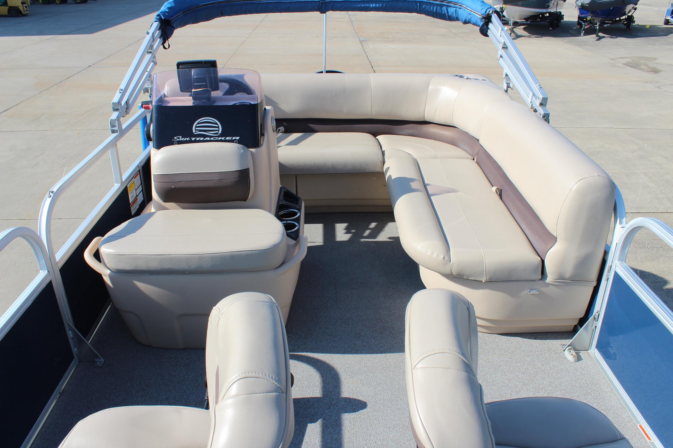 2019 Sun Tracker Bass Buggy 16 XL Select pontoon boat interior with beige seating.
