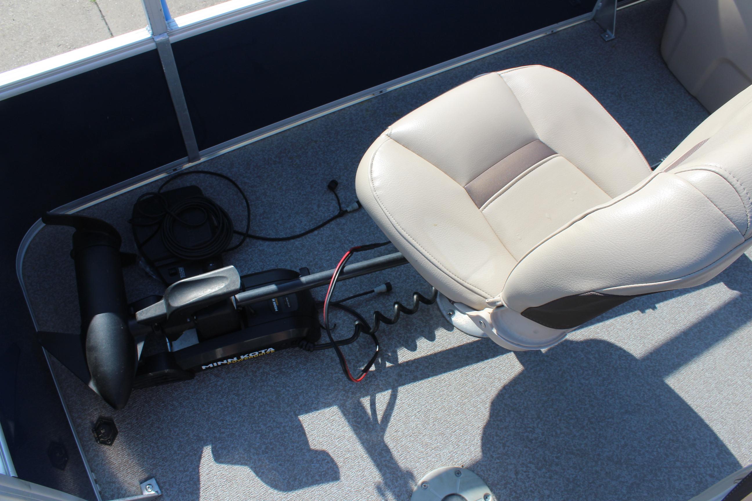 2019 Sun Tracker Bass Buggy 16 XL Select boat interior with seat and trolling motor.