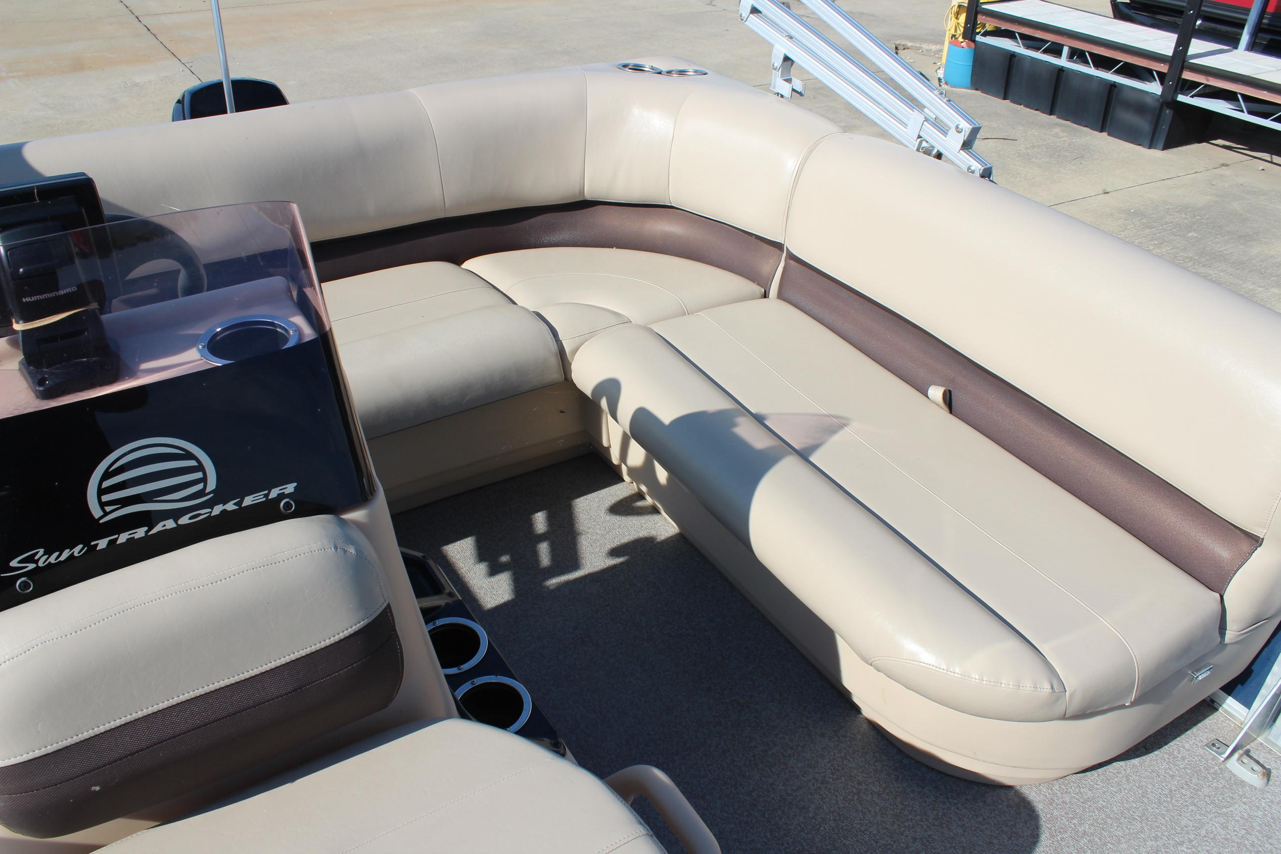 2019 Sun Tracker Bass Buggy 16 XL Select pontoon boat interior with beige seating.