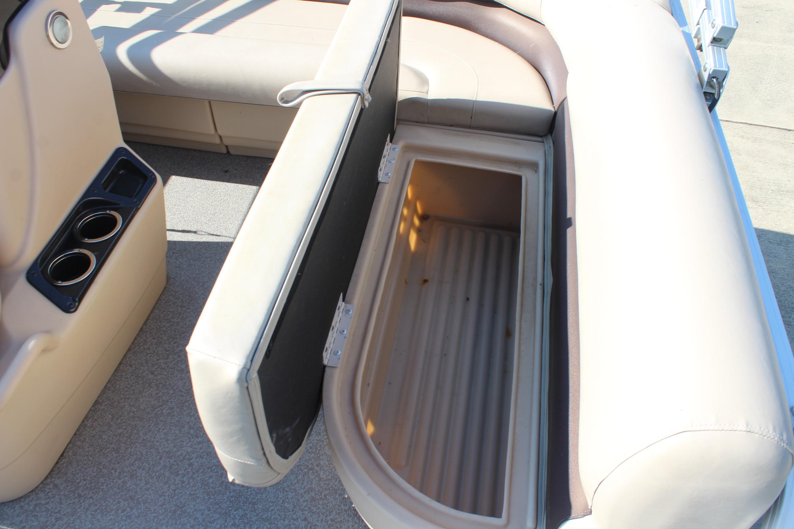 2019 Sun Tracker Bass Buggy 16 XL Select boat seat storage compartment open.