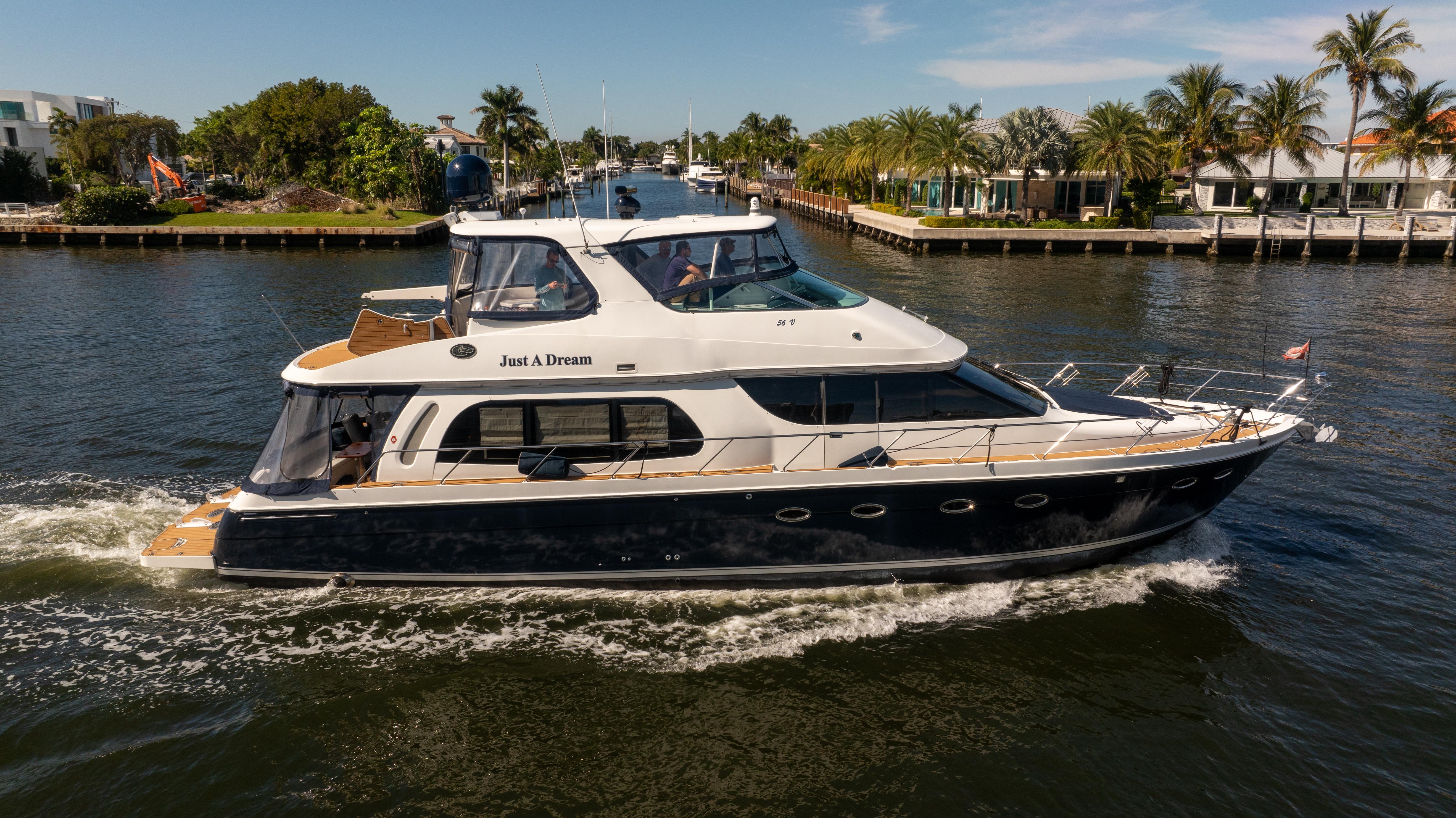 Carver-56 Voyager 2005-Just A Dream FL-US-2005 Carver 56 Voyager yacht cruising on a scenic waterway with palm trees.-9669425 | Thumbnail