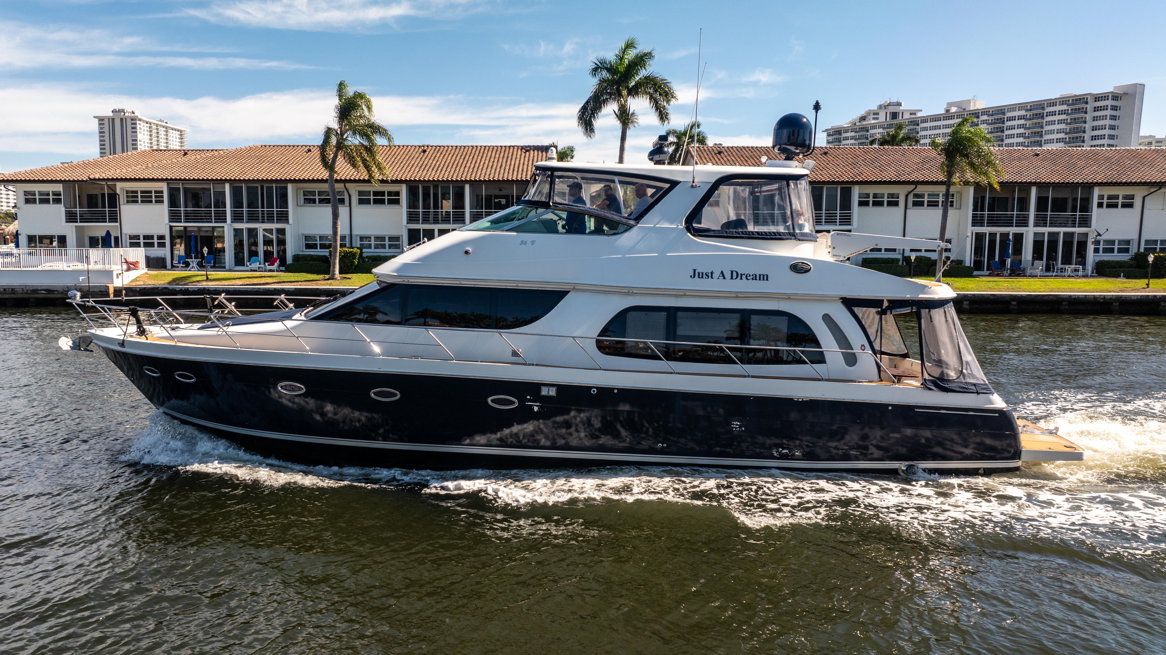 Carver-56 Voyager 2005-Just A Dream FL-US-2005 Carver 56 Voyager yacht cruising on a sunny day near waterfront buildings.-9669425 | Thumbnail
