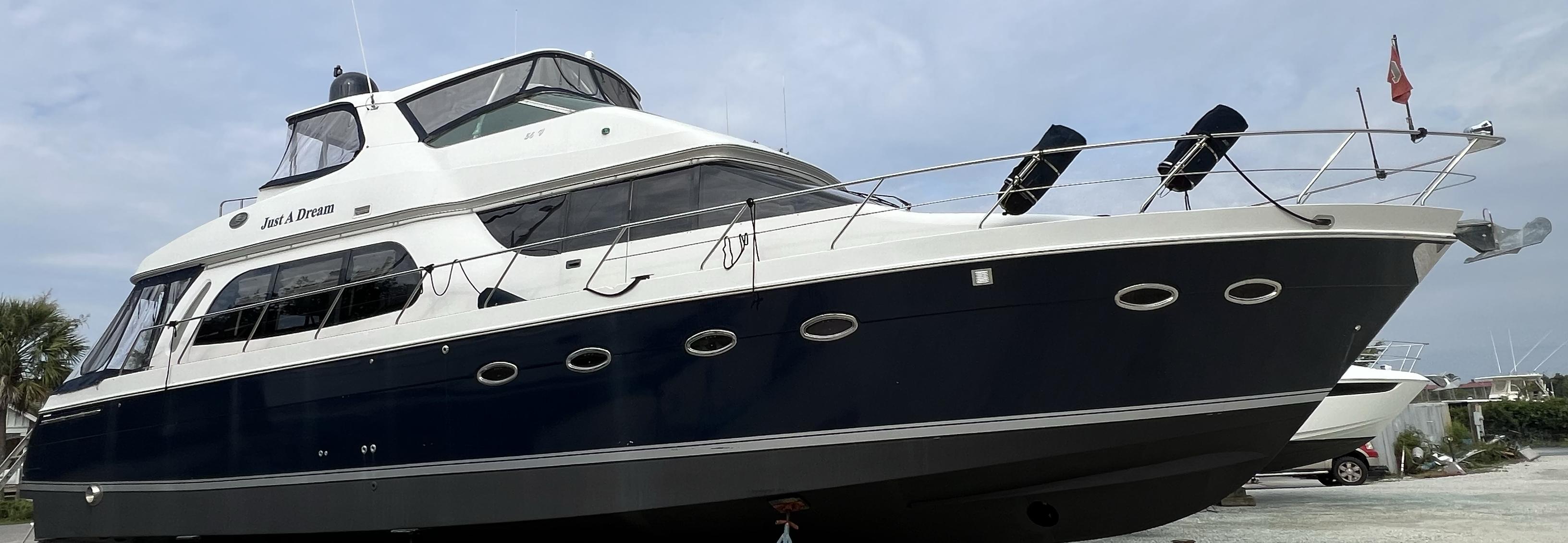 Carver-56 Voyager 2005-Just A Dream FL-US-2005 Carver 56 Voyager yacht with sleek design, docked under a cloudy sky.-9669425 | Thumbnail