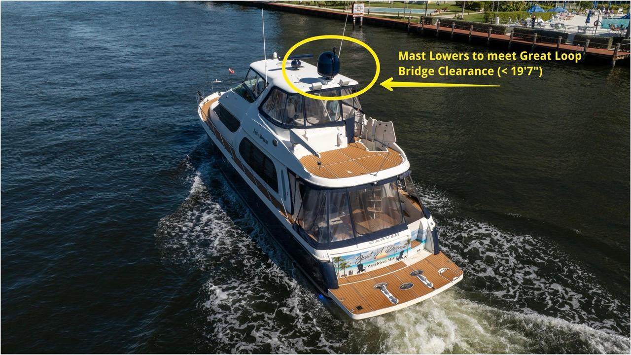 Carver-56 Voyager 2005-Just A Dream FL-US-2005 Carver 56 Voyager yacht navigating waterway, featuring adjustable mast for bridge clearance.-9669425 | Thumbnail