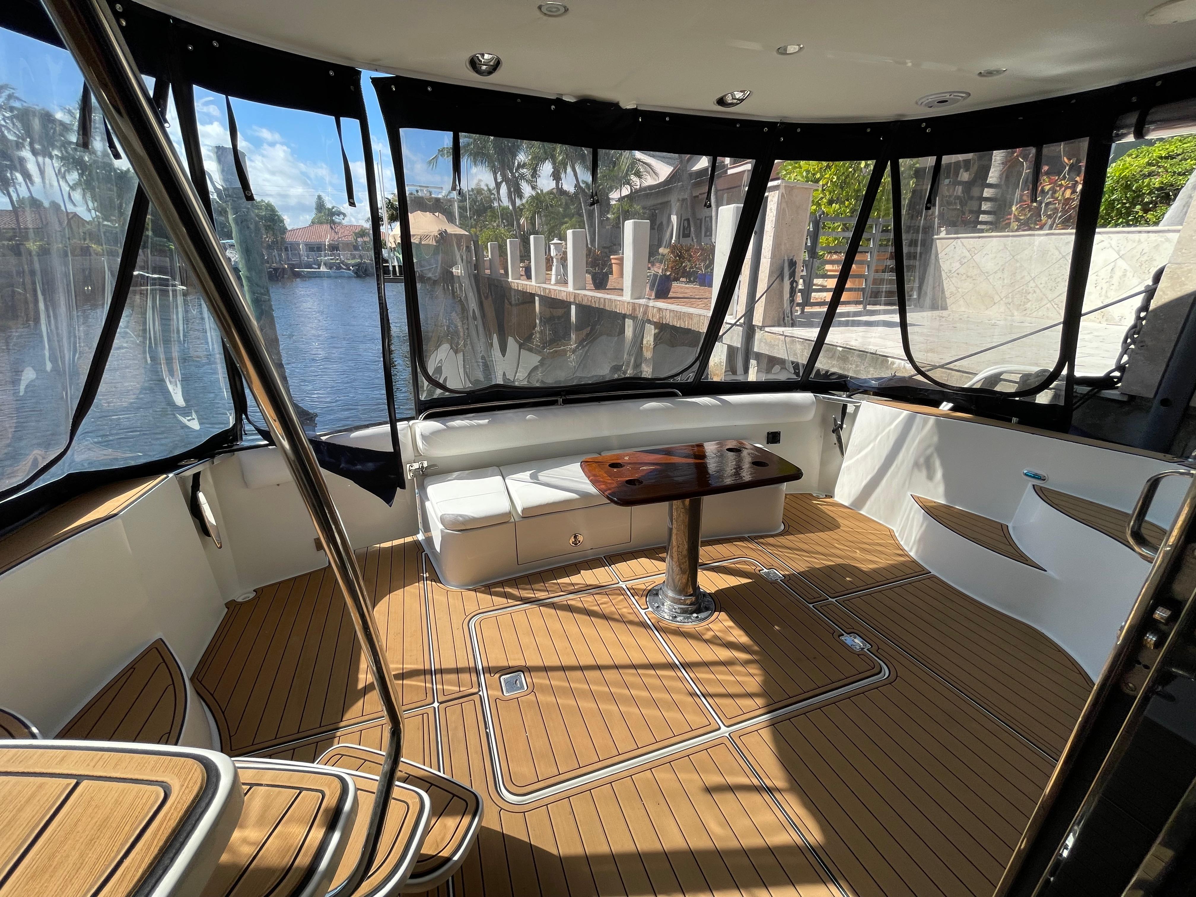 Carver-56 Voyager 2005-Just A Dream FL-US-2005 Carver 56 Voyager yacht interior with wood flooring and waterfront view.-9669425 | Thumbnail