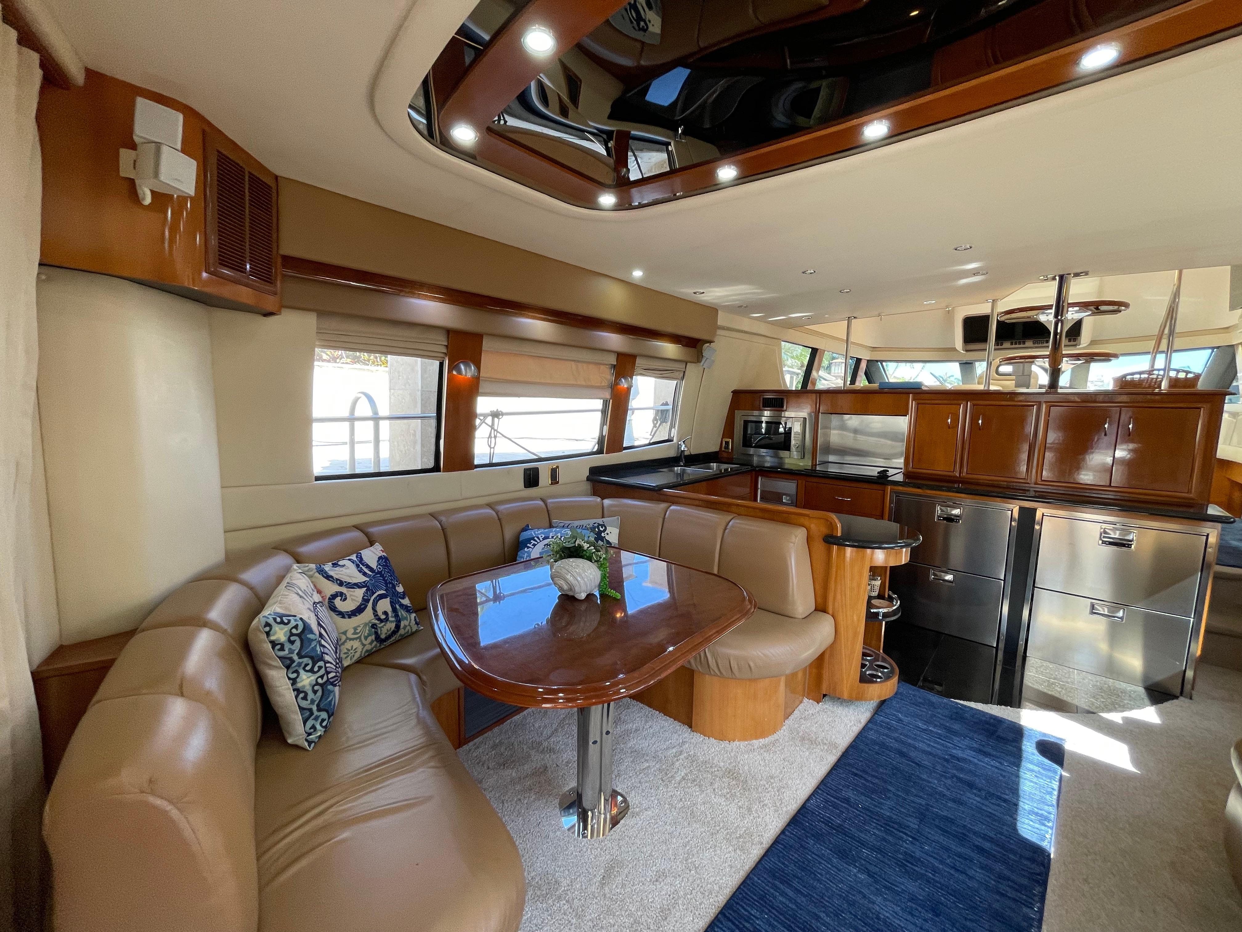 Carver-56 Voyager 2005-Just A Dream FL-US-Luxurious interior of 2005 Carver 56 Voyager yacht with elegant seating and modern kitchen.-9669425 | Thumbnail
