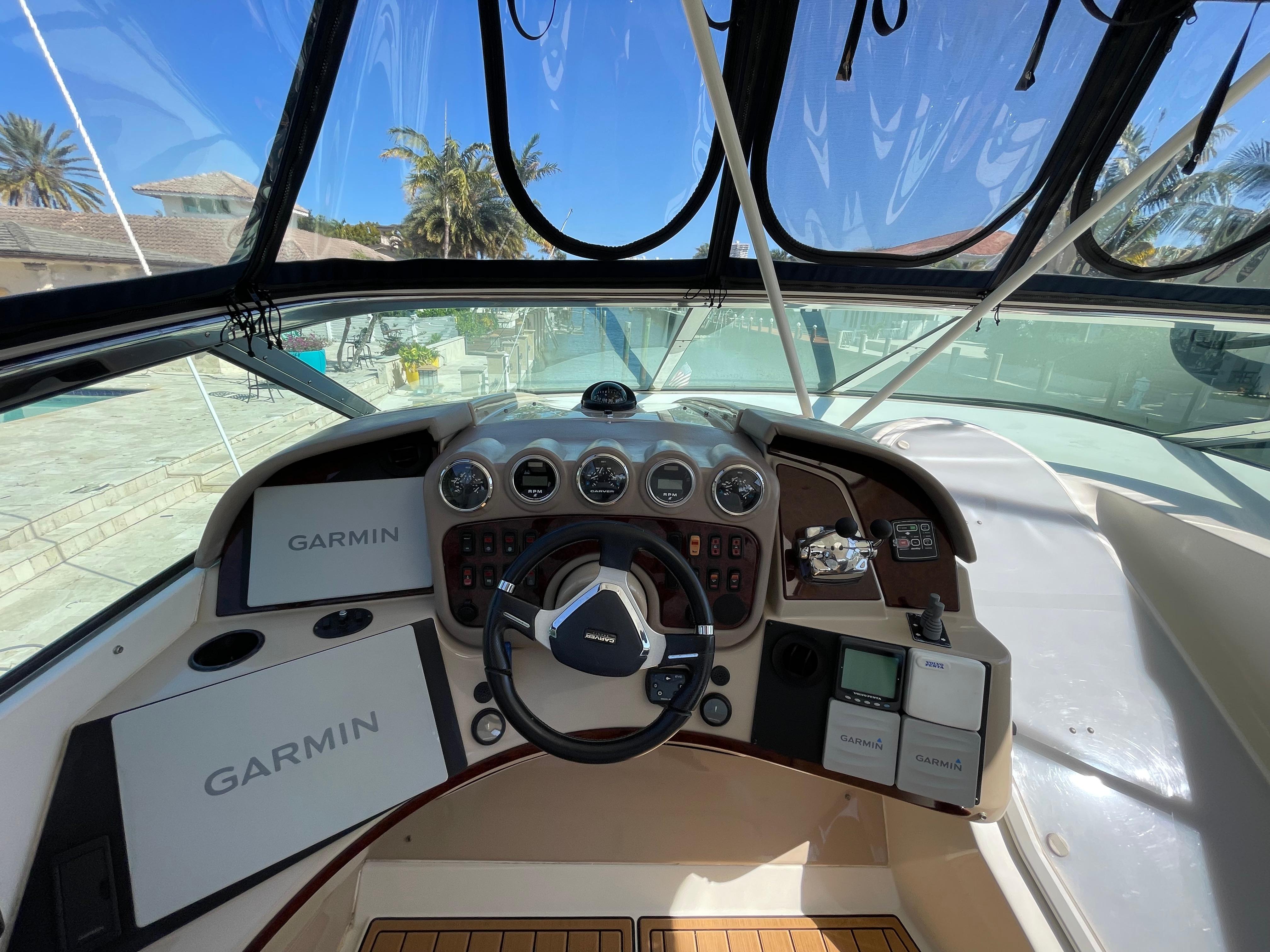 Carver-56 Voyager 2005-Just A Dream FL-US-2005 Carver 56 Voyager helm with Garmin navigation system and steering wheel.-9669425 | Thumbnail
