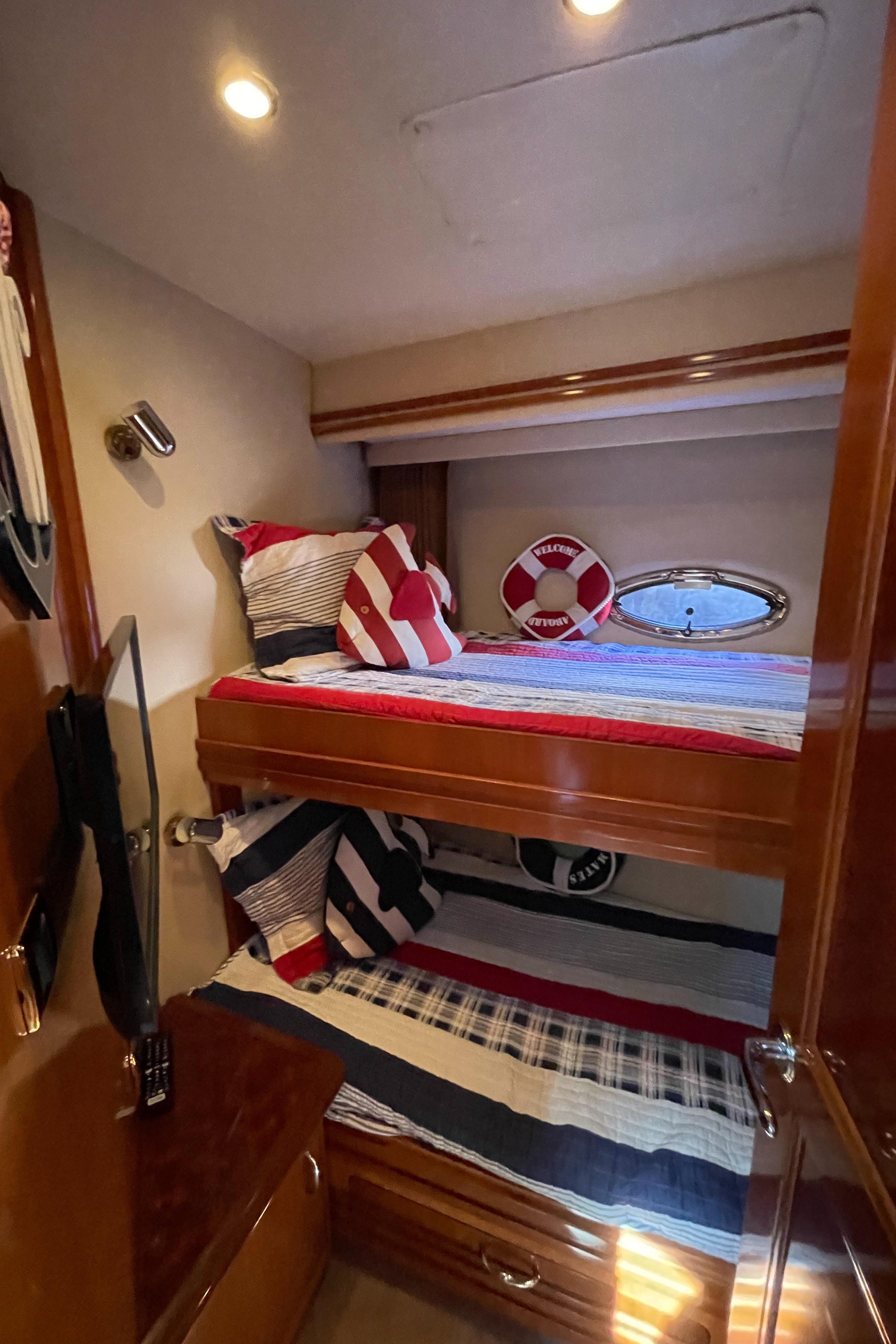 Carver-56 Voyager 2005-Just A Dream FL-US-2005 Carver 56 Voyager cabin with bunk beds, nautical decor, and wood finish.-9669425 | Thumbnail