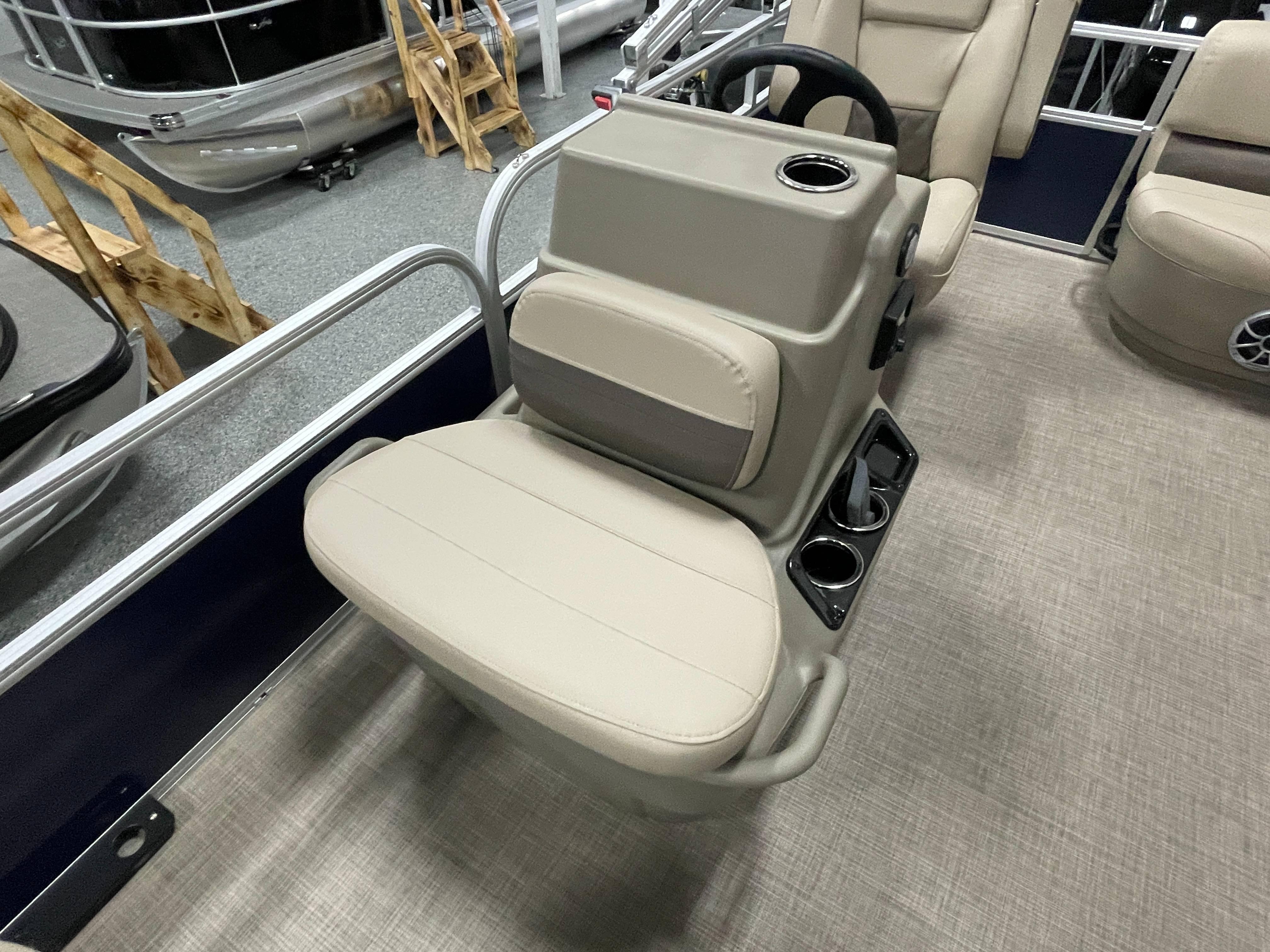 2025 Sun Tracker Bass Buggy 16 XL Select interior with beige seating and steering console.