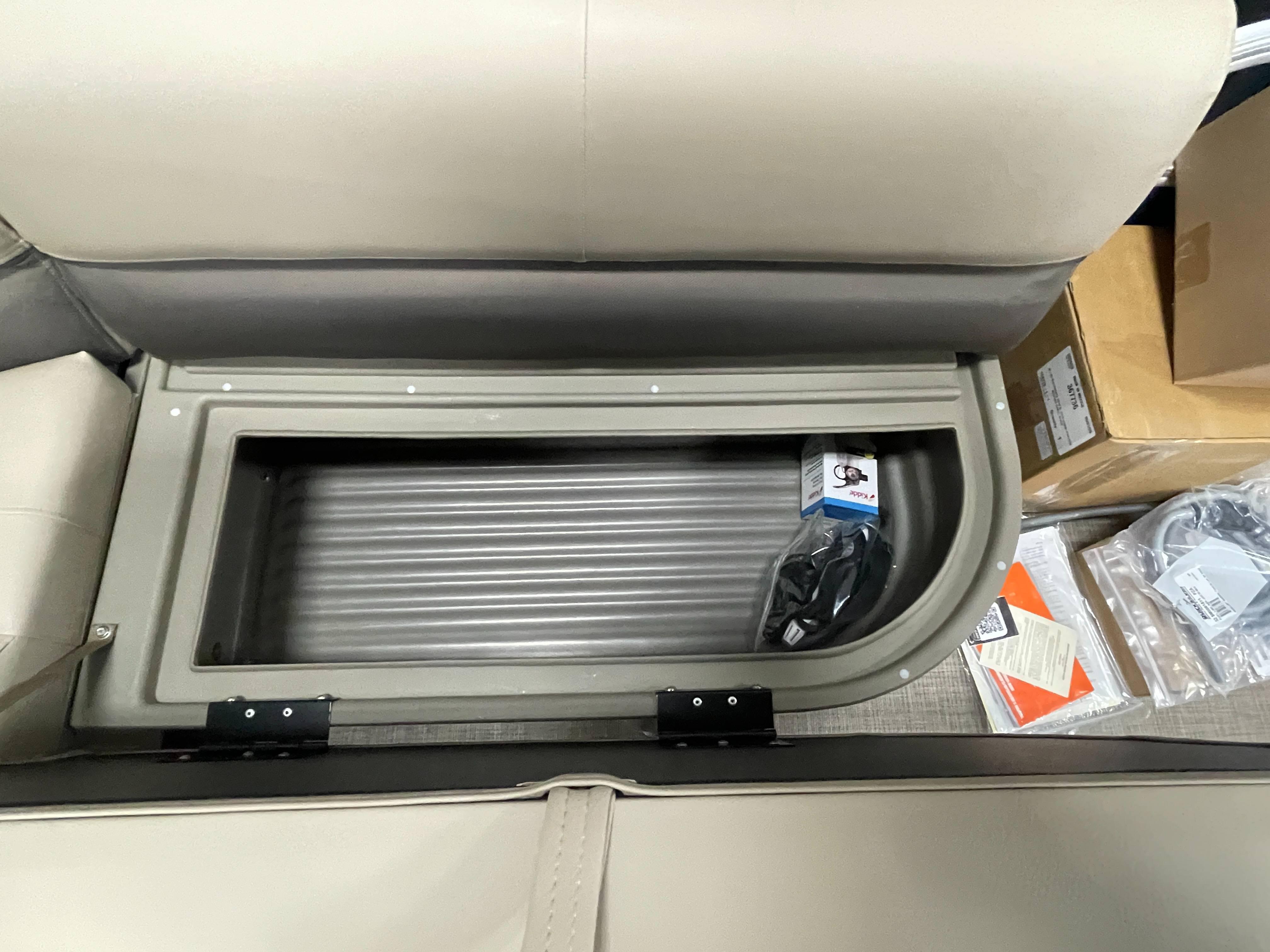 Storage compartment in 2025 Sun Tracker Bass Buggy 16 XL Select pontoon boat.