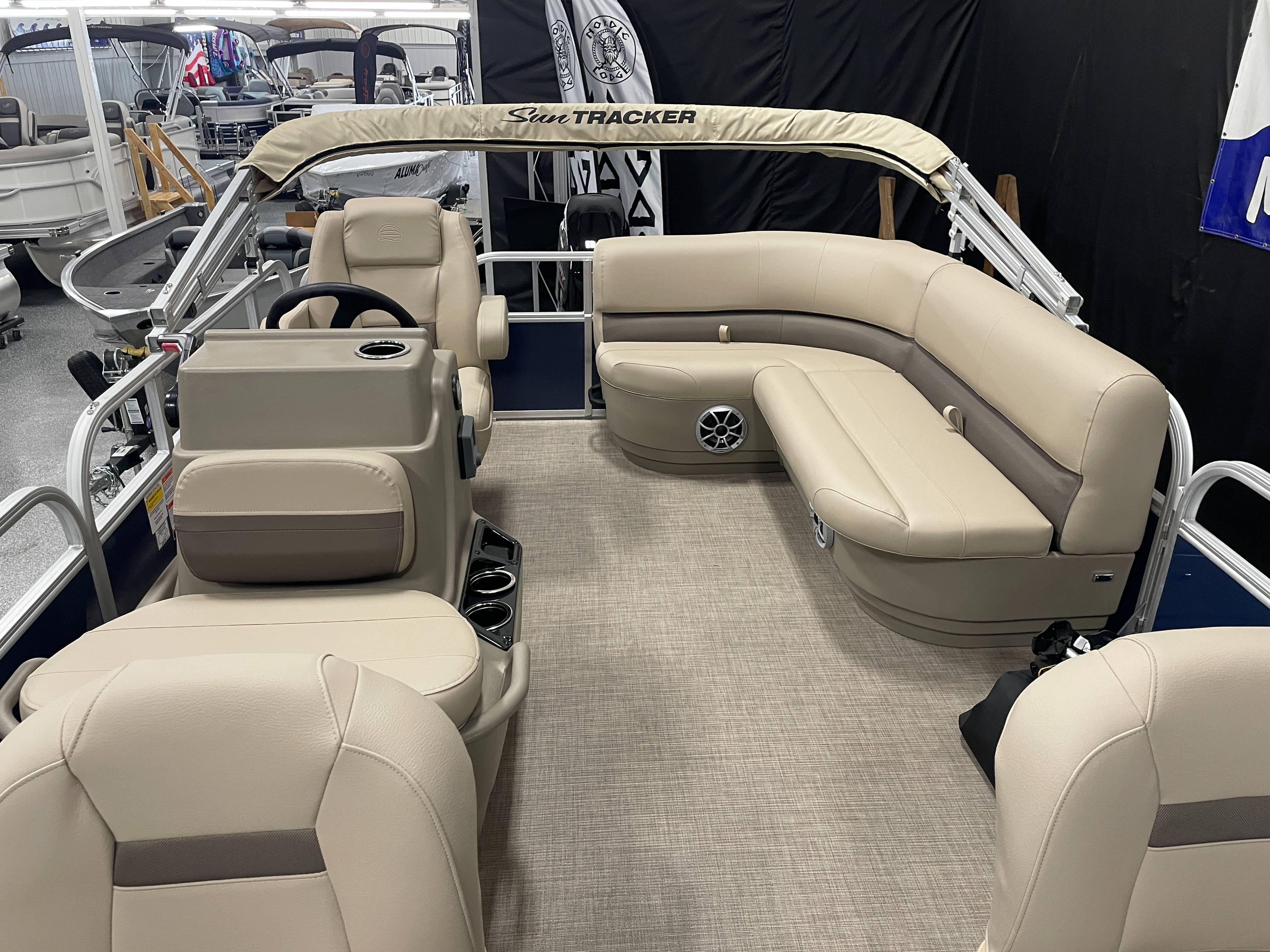 2025 Sun Tracker Bass Buggy 16 XL Select pontoon boat interior with beige seating.