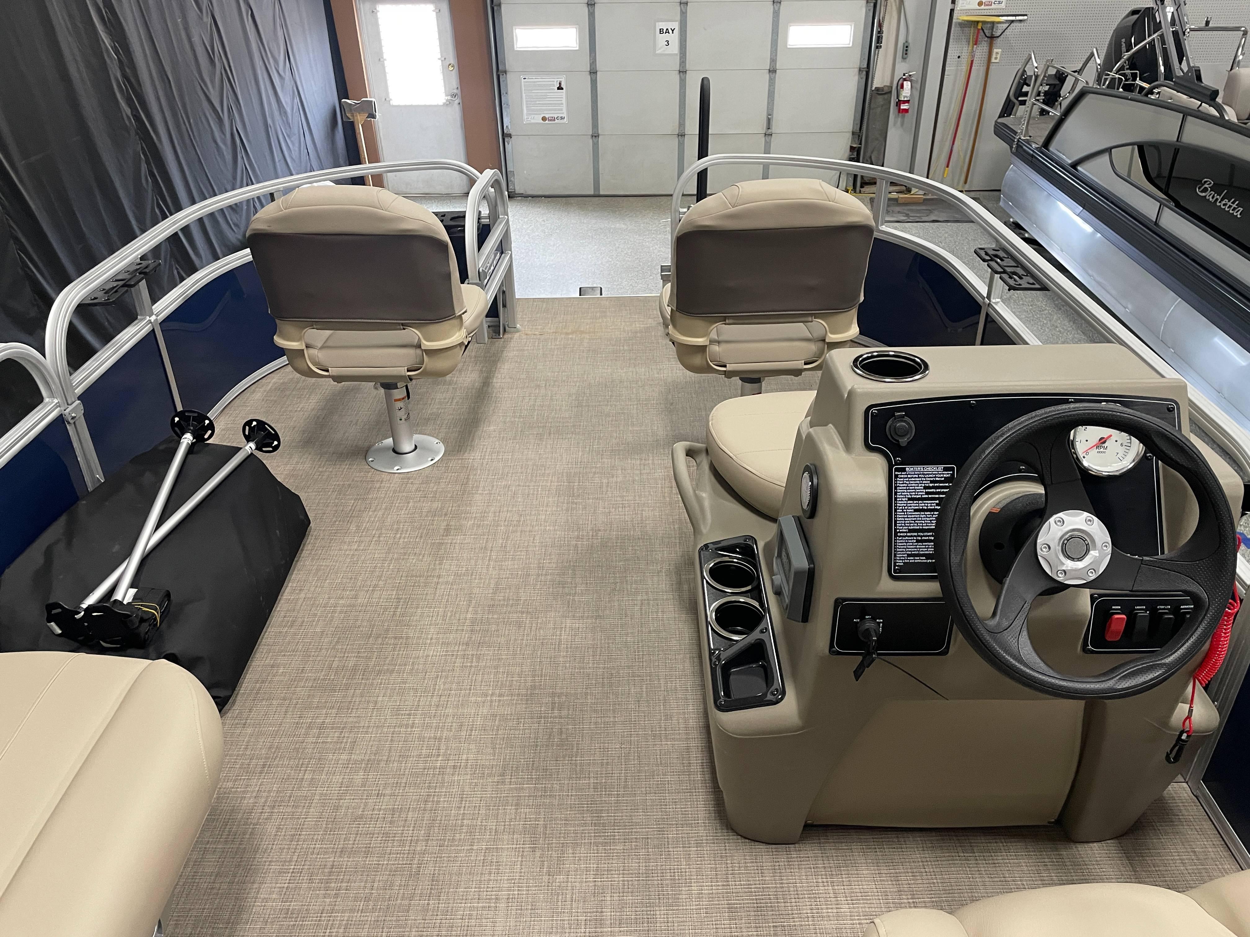 2025 Sun Tracker Bass Buggy 16 XL Select interior with steering console and seating.