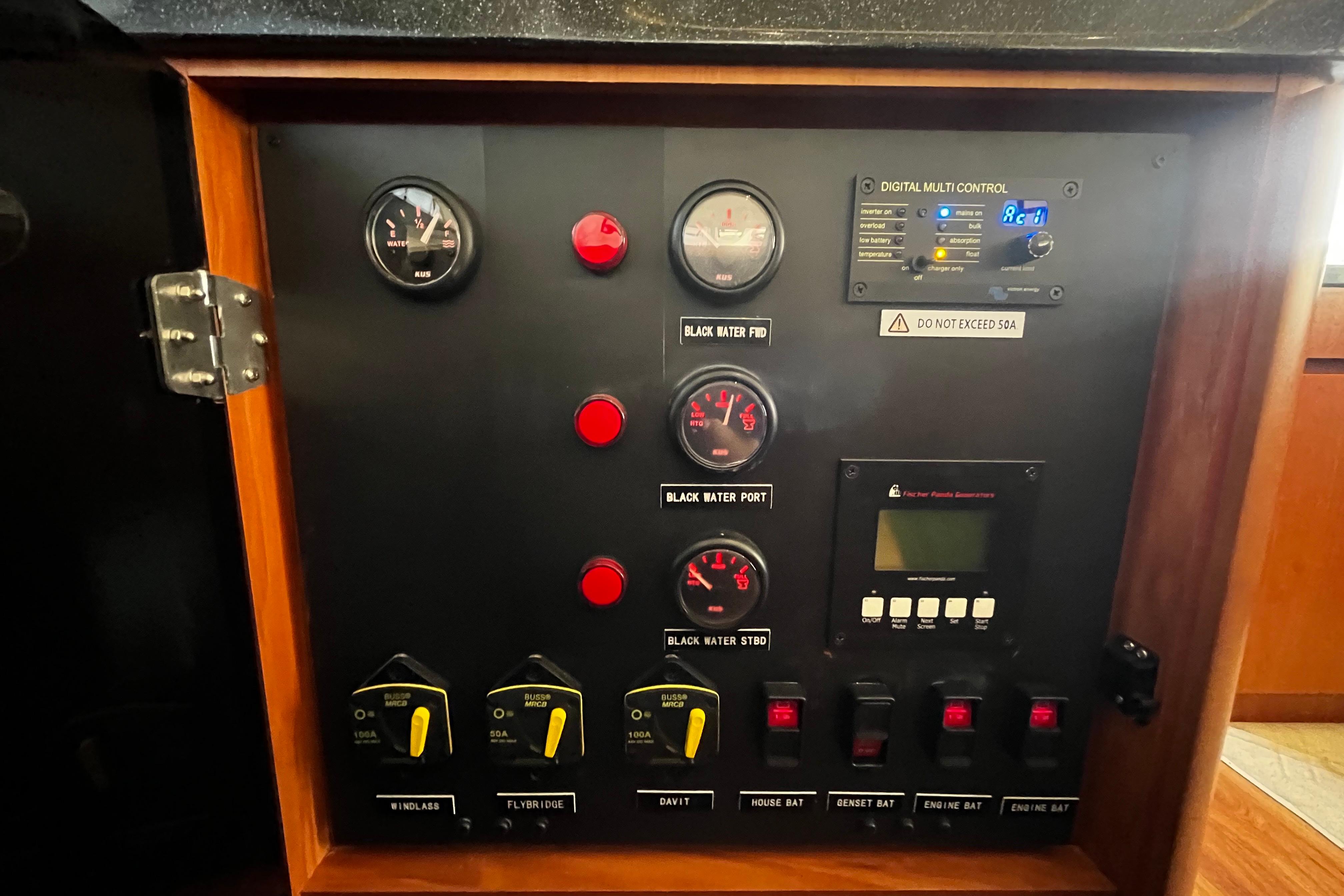 Control panel of a 2016 Aquila 44 yacht with gauges and switches.
