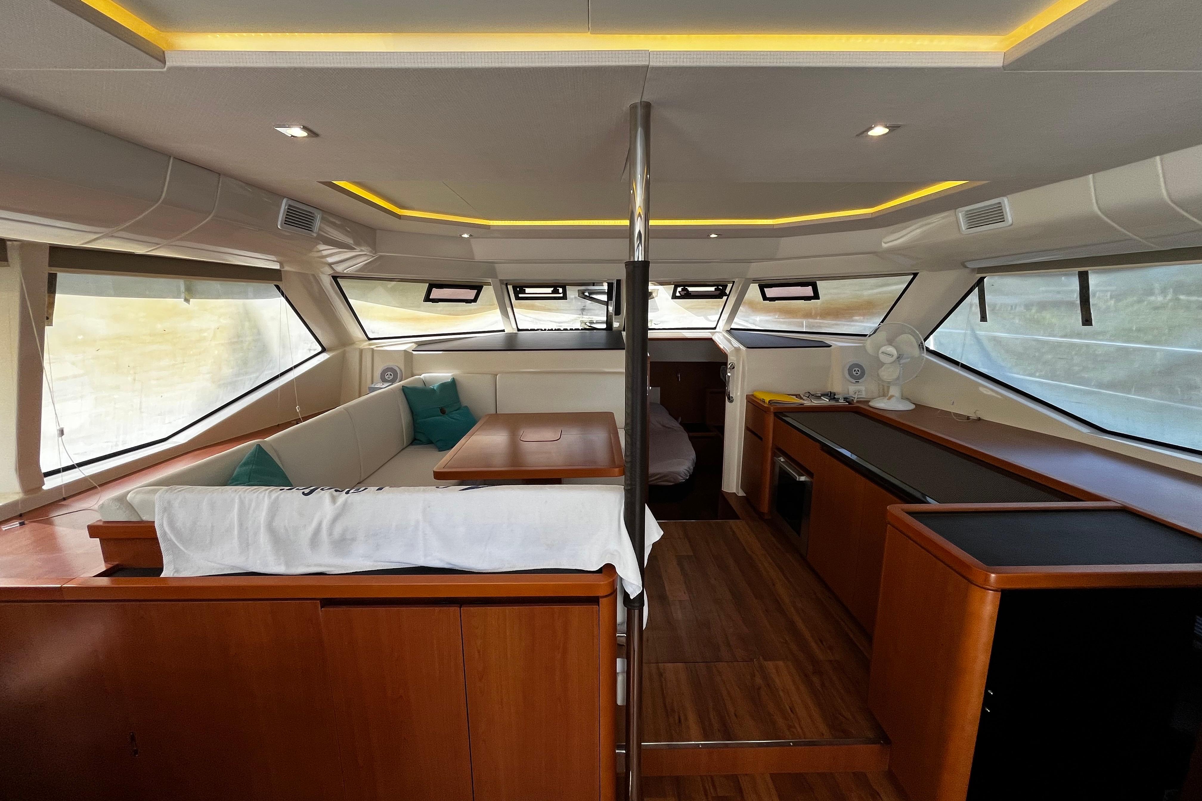 Luxurious interior of 2016 Aquila 44 yacht with modern furnishings and panoramic windows.