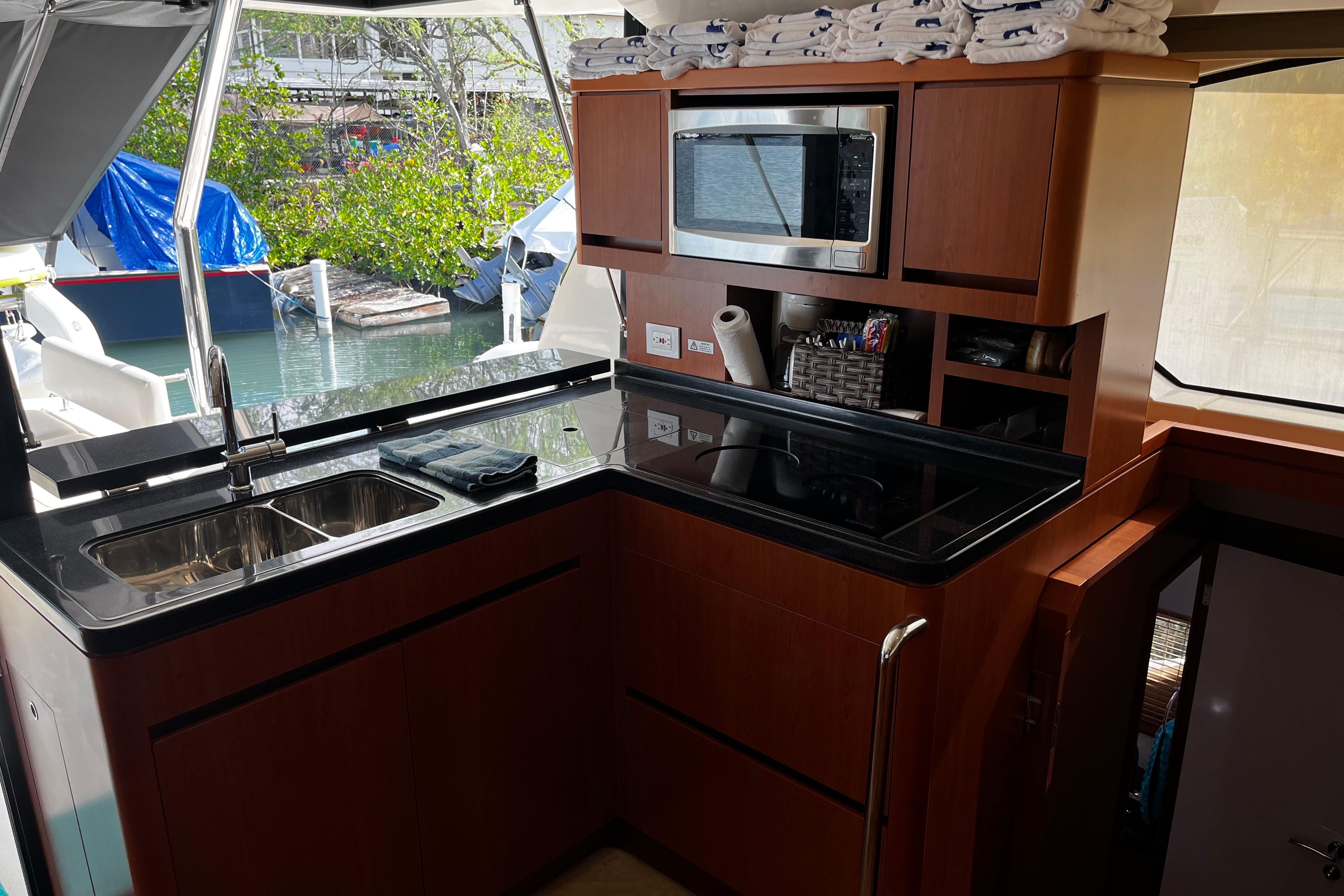 Luxurious kitchen area on a 2016 Aquila 44 yacht with modern amenities.