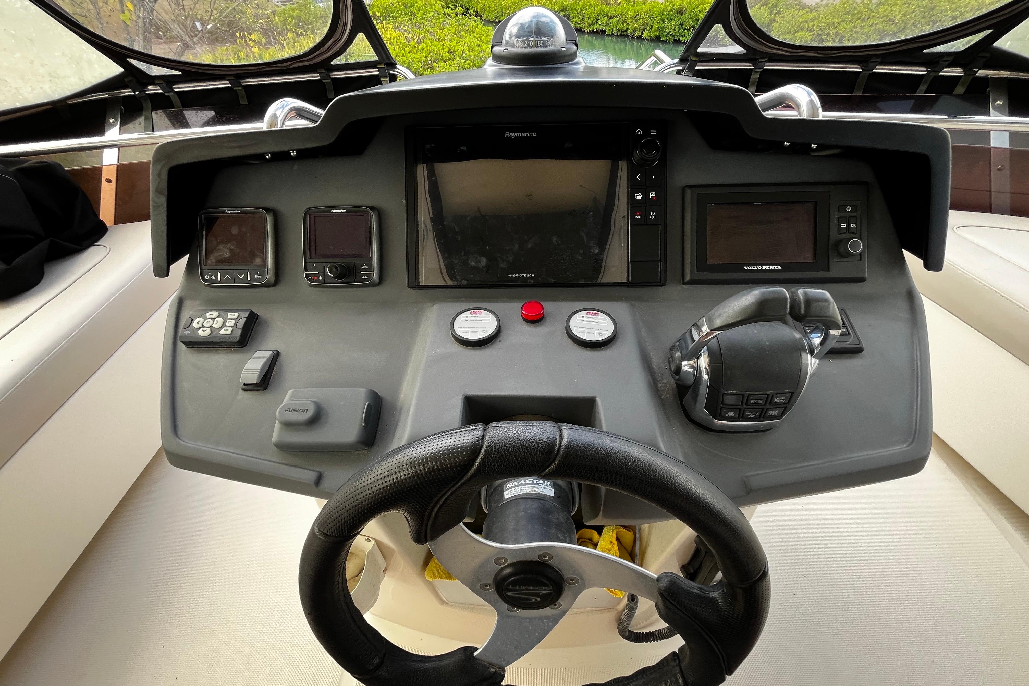 Aquila 44 yacht helm with navigation controls and steering wheel, 2016 model.