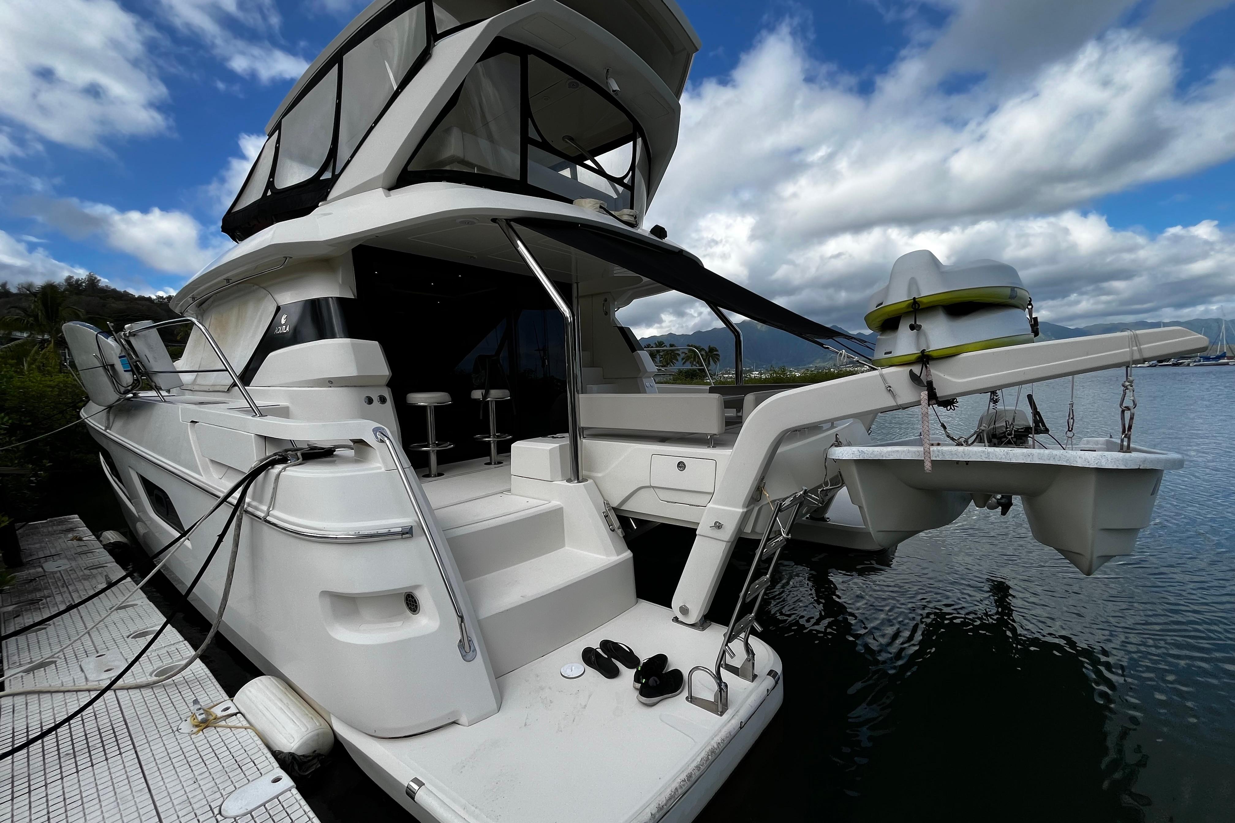 Aquila 44 yacht, 2016 model, docked with clear skies and calm waters.