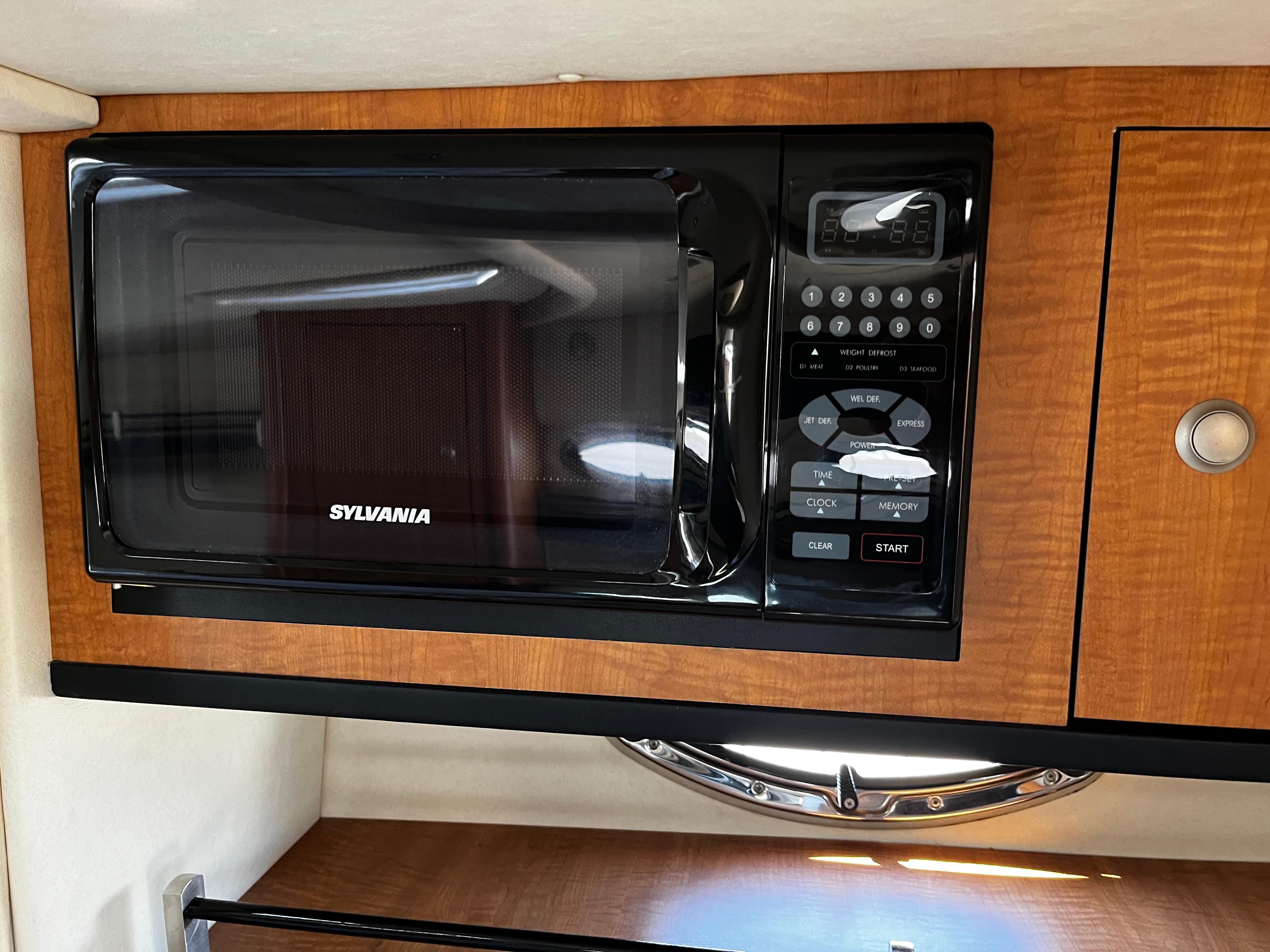 Sylvania microwave in 2006 Sea Ray 290 Sundancer boat kitchen.