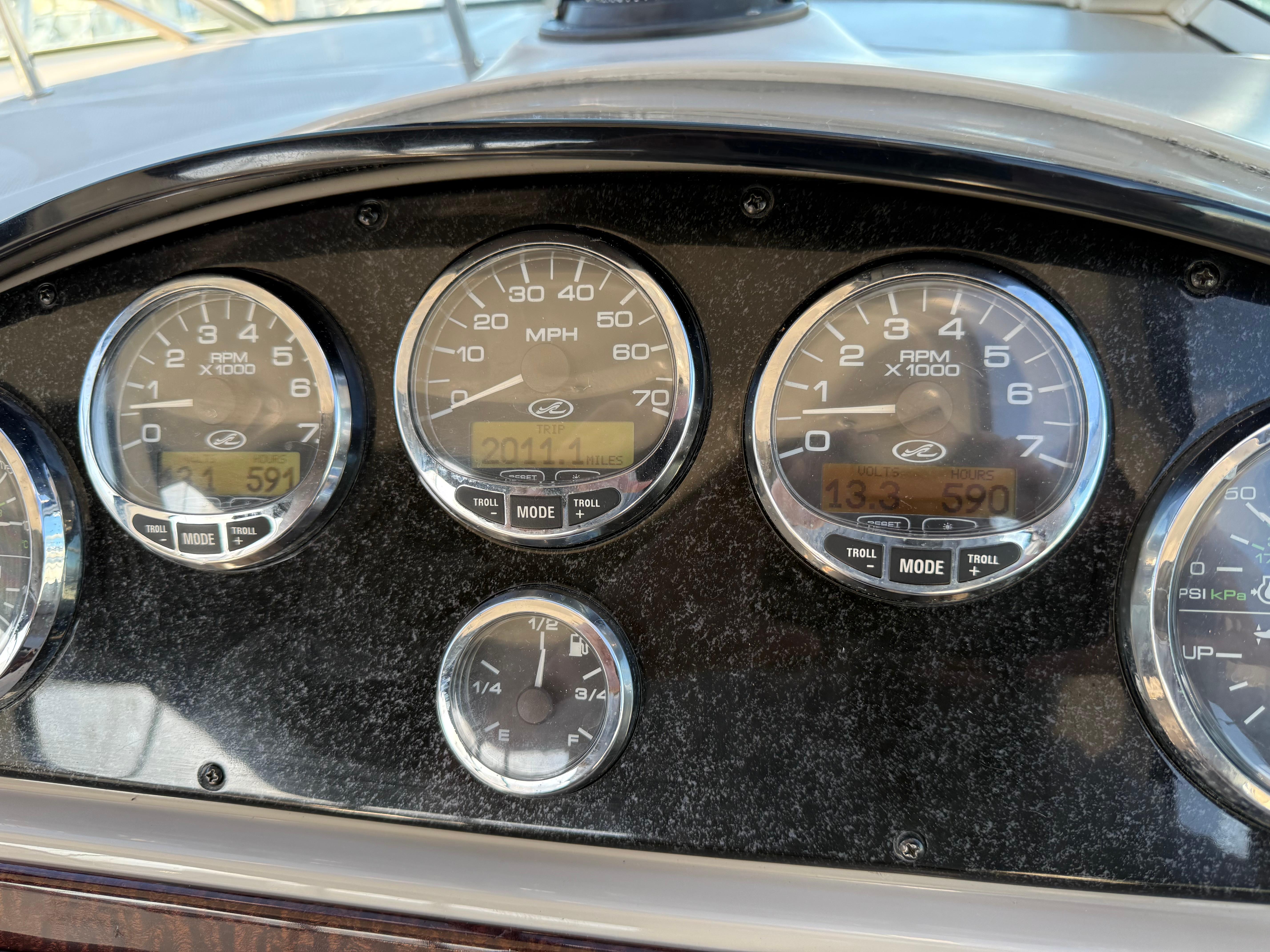 Dashboard of a 2006 Sea Ray 290 Sundancer boat with gauges and controls.