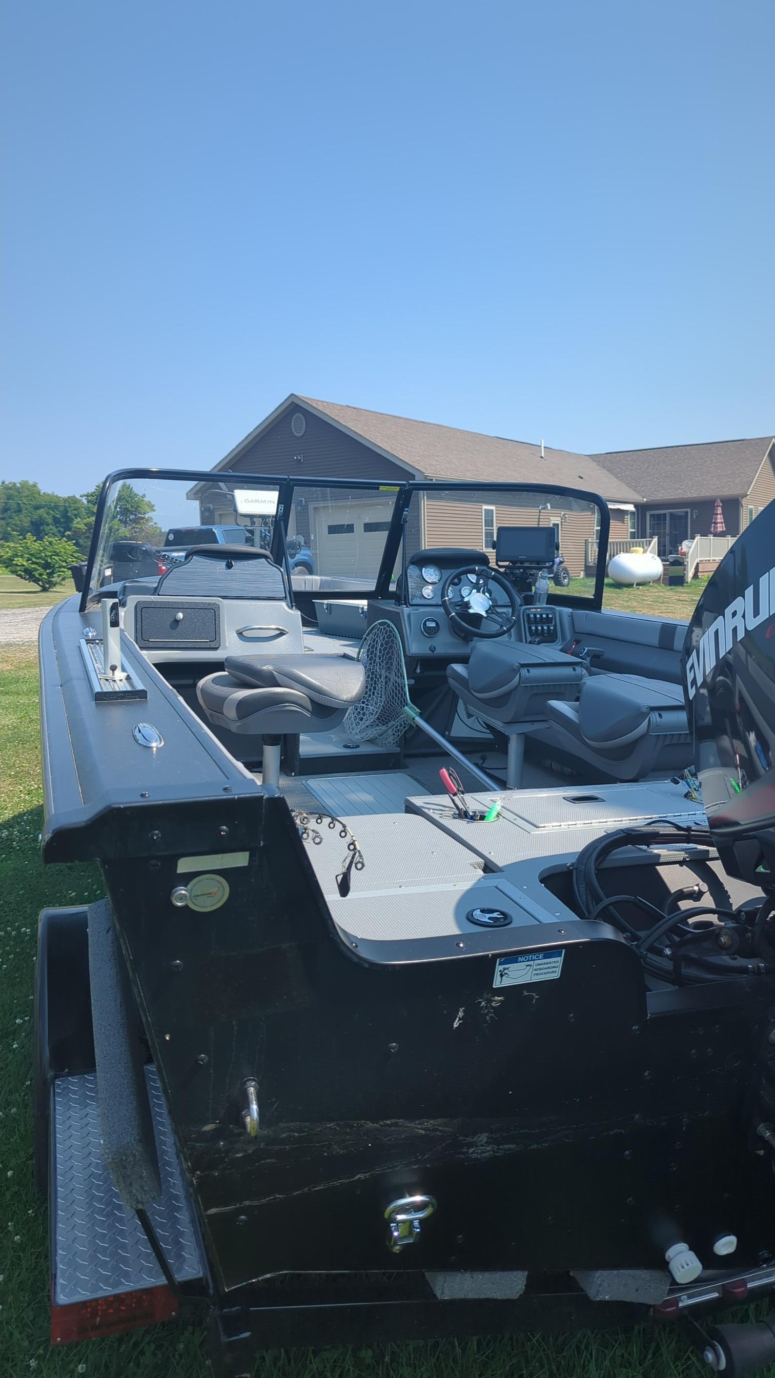 2019 Starcraft Titan 186 boat on trailer, parked outdoors under clear blue sky.