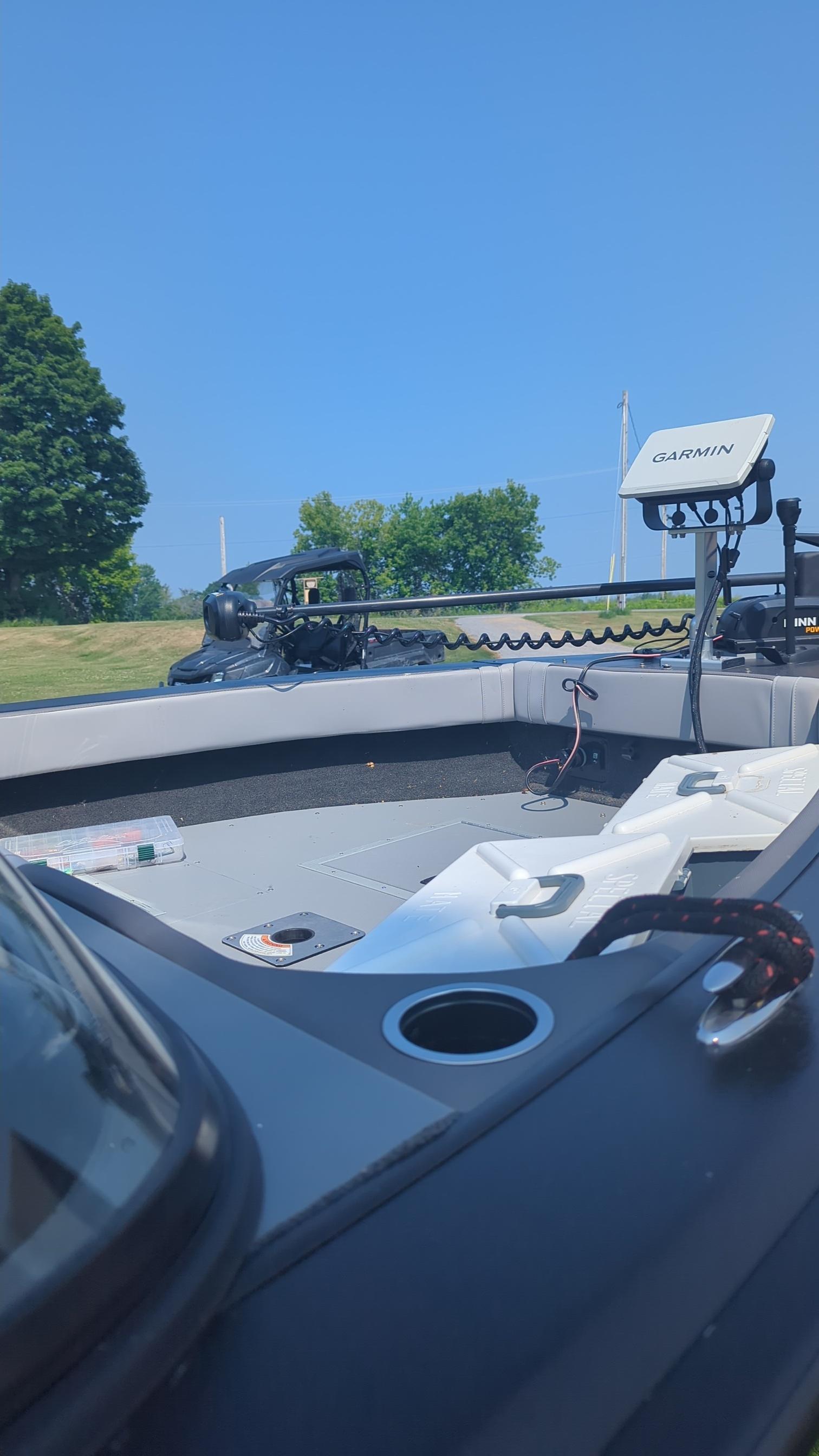 2019 Starcraft Titan 186 boat interior with Garmin equipment, under clear blue sky.