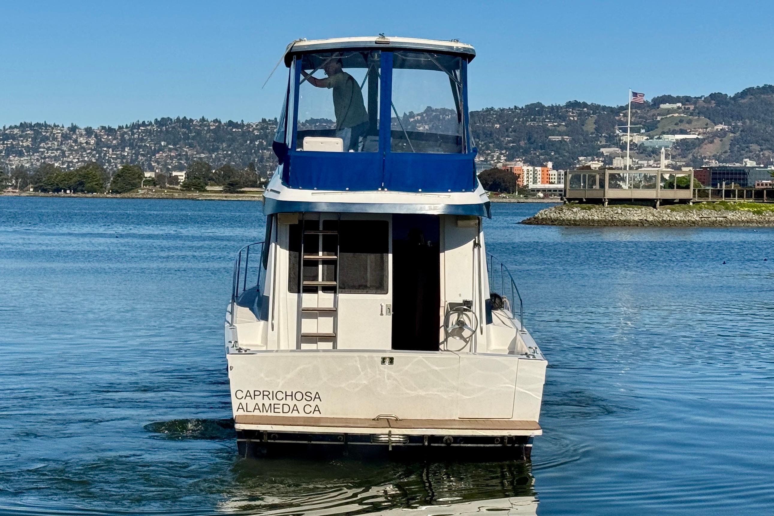 1989 Mediterranean 38 boat named Caprichosa on calm water near Alameda, CA.