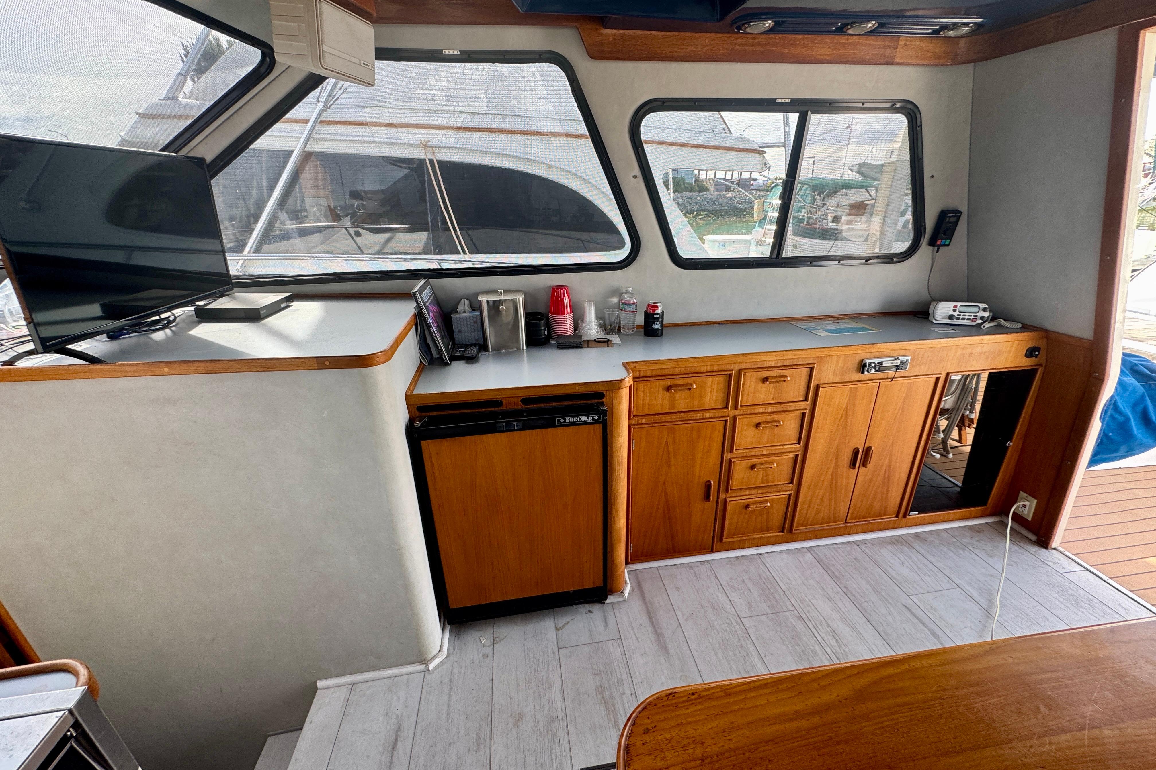 Interior of 1989 Mediterranean 38 boat with wooden cabinets and modern amenities.