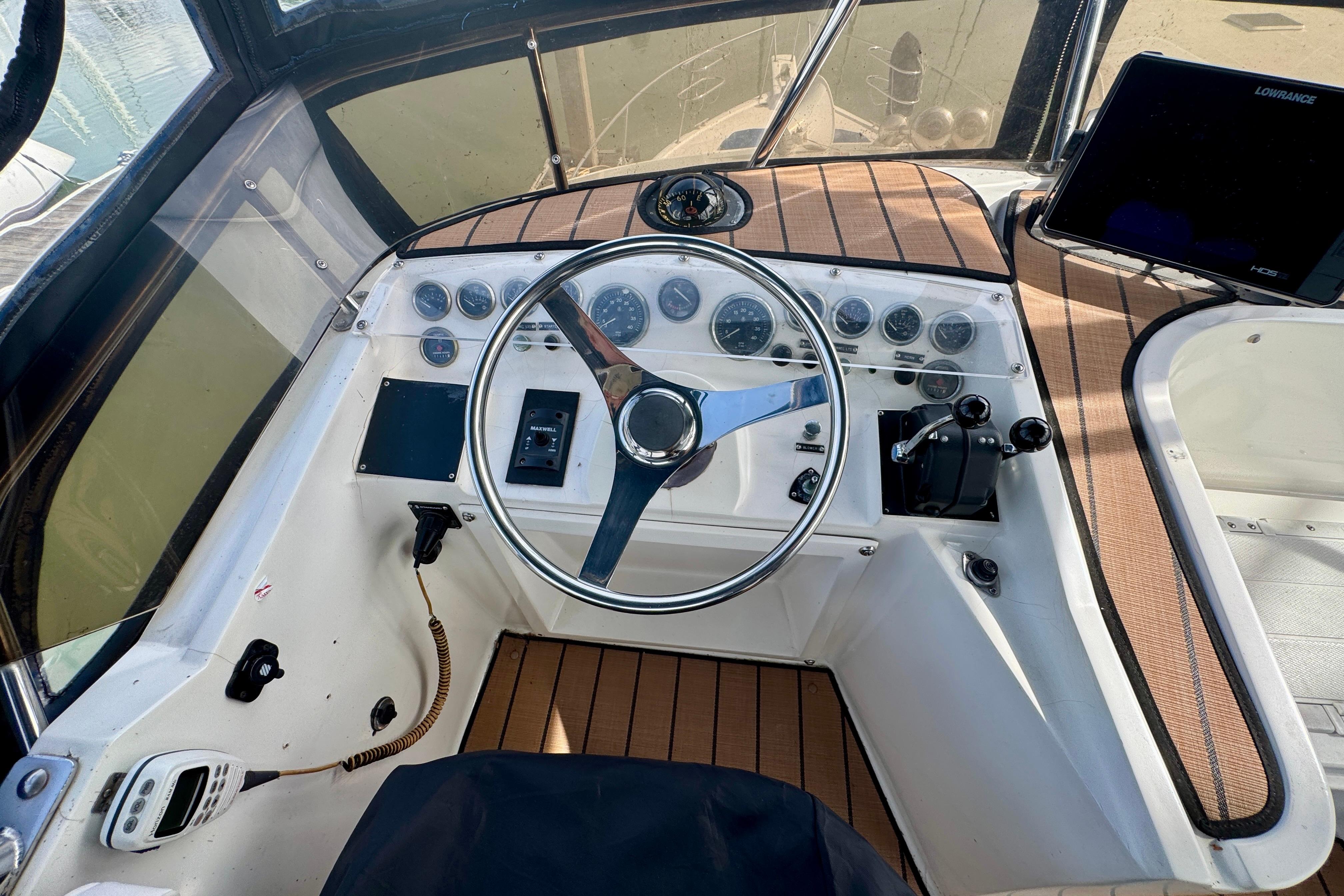 Cockpit of a 1989 Mediterranean 38 boat with steering wheel and control panel.