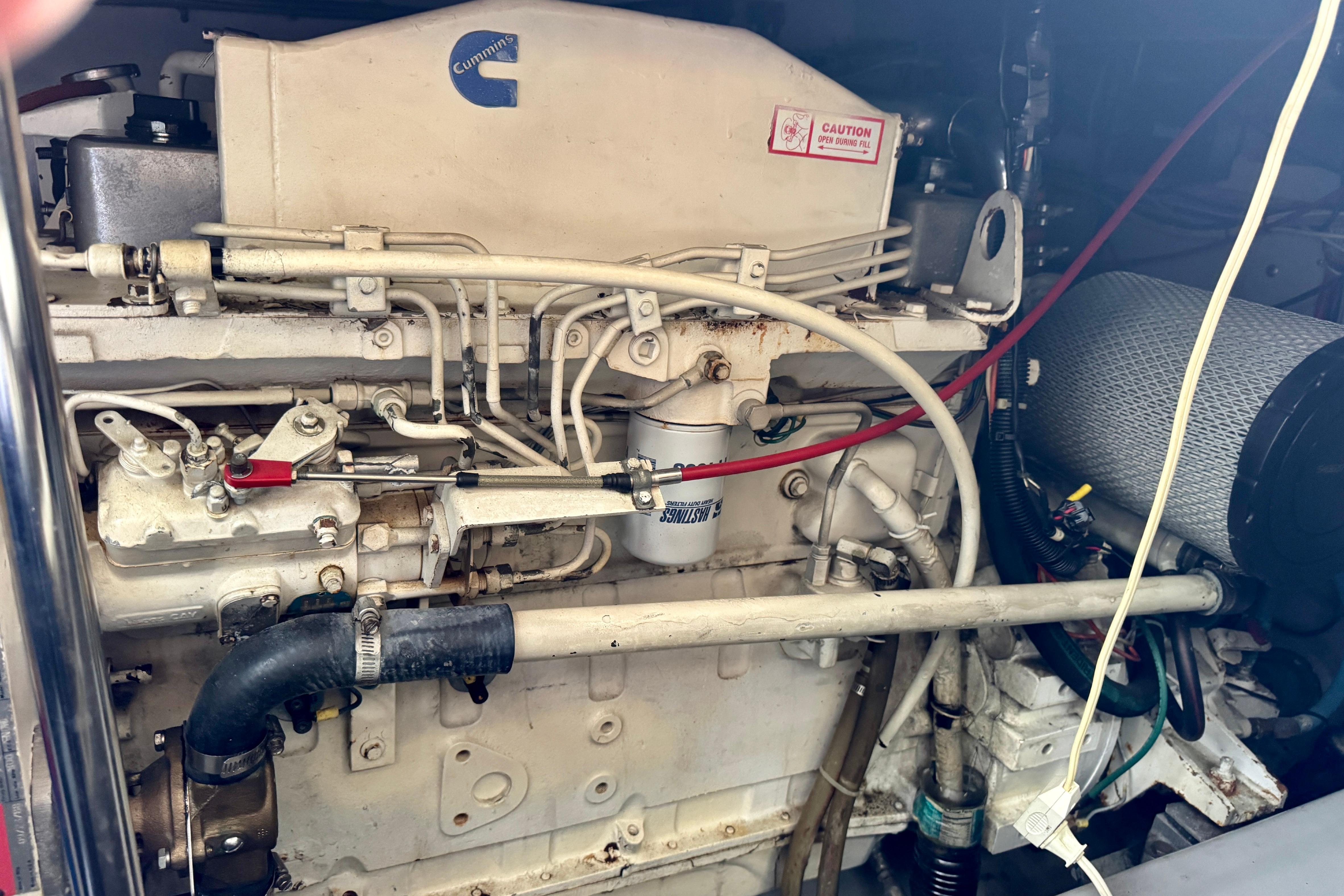 Engine compartment of a 1989 Mediterranean 38 boat, featuring Cummins components.