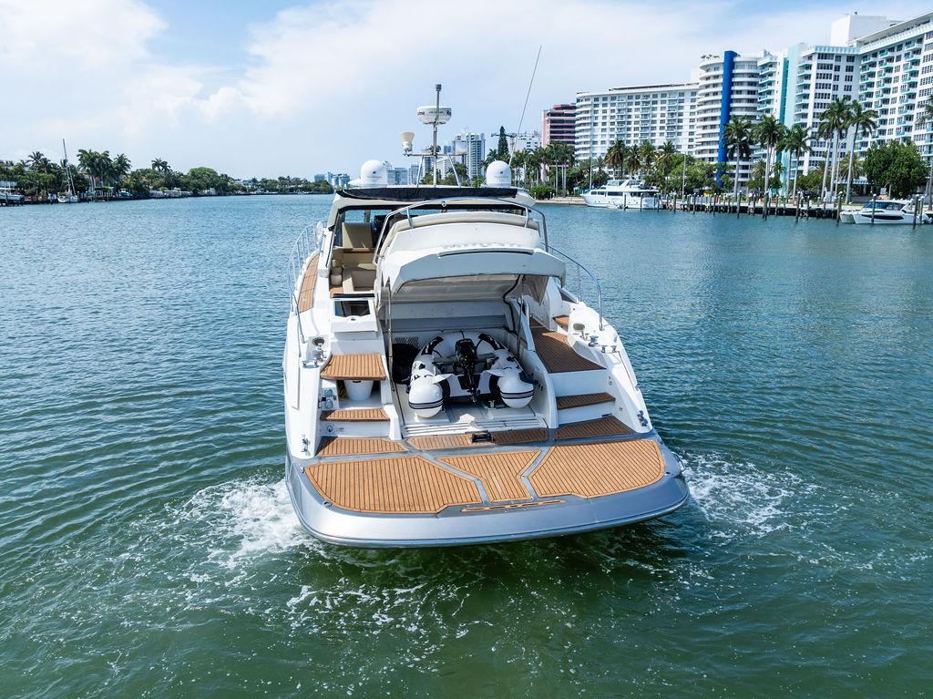 Cranchi-56 HT 2014-Minion FL-US-2014 Cranchi 56 HT yacht cruising on a scenic waterway with city skyline.-9819548 | Thumbnail