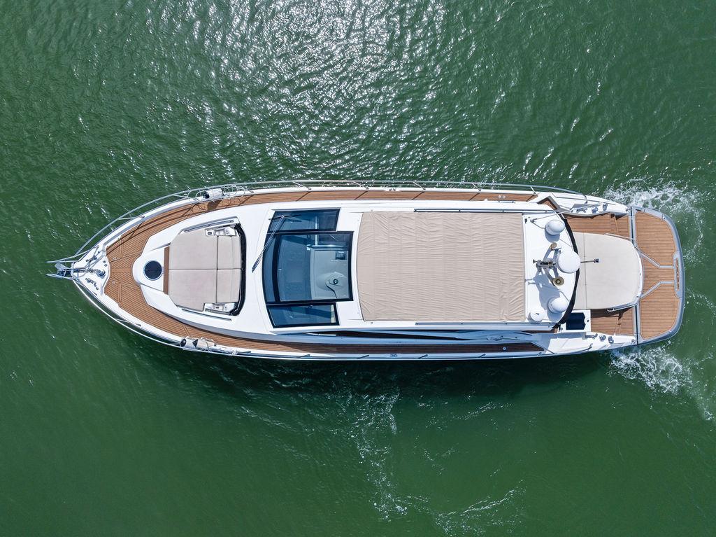 Cranchi-56 HT 2014-Minion FL-US-Aerial view of 2014 Cranchi 56 HT yacht cruising on green water.-9819548 | Thumbnail