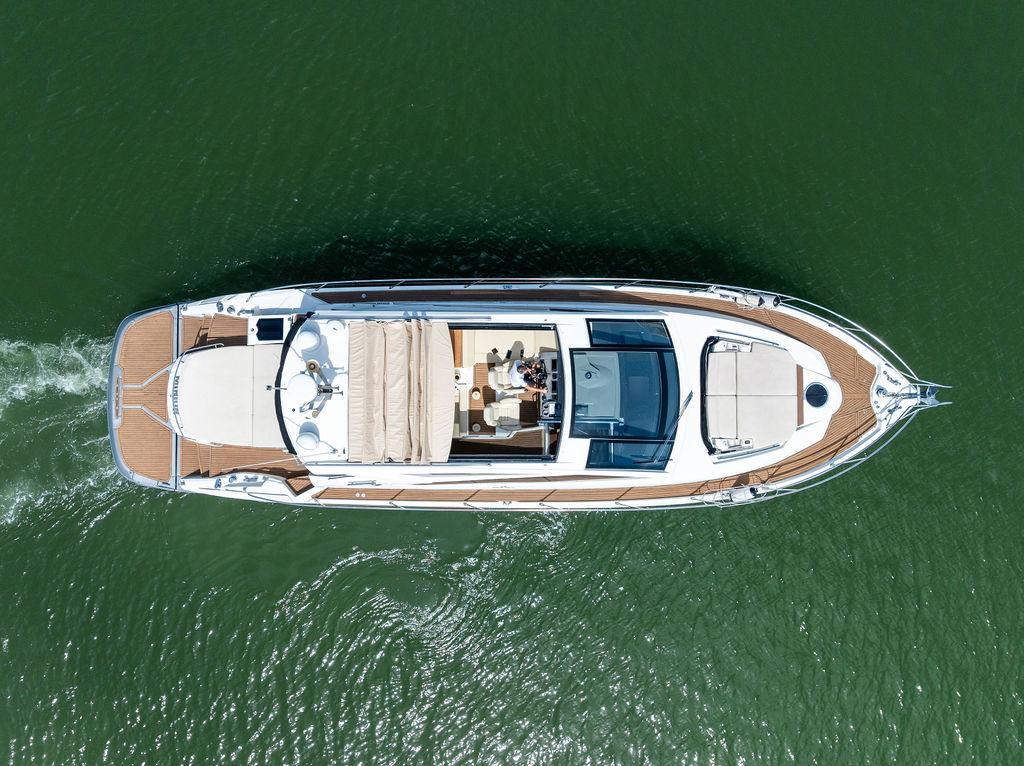 Cranchi-56 HT 2014-Minion FL-US-Overhead view of 2014 Cranchi 56 HT yacht cruising on green water.-9819548 | Thumbnail