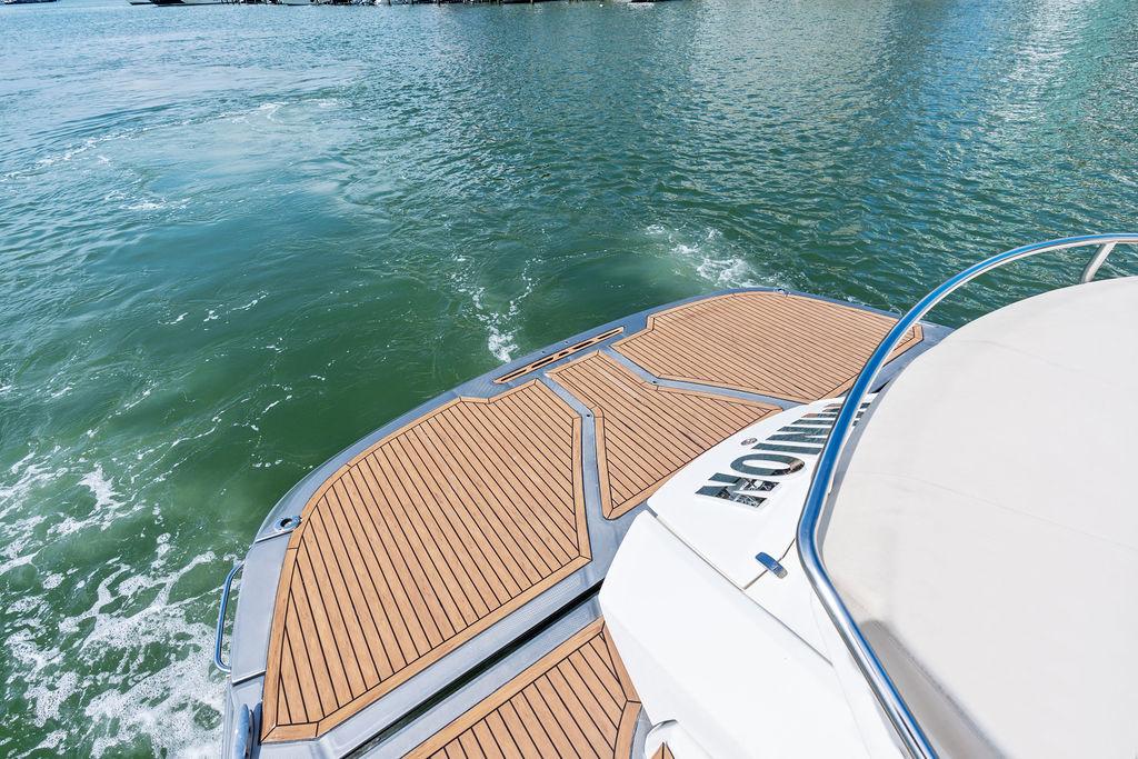 Cranchi-56 HT 2014-Minion FL-US-Cranchi 56 HT 2014 yacht with teak deck on calm water.-9819548 | Thumbnail