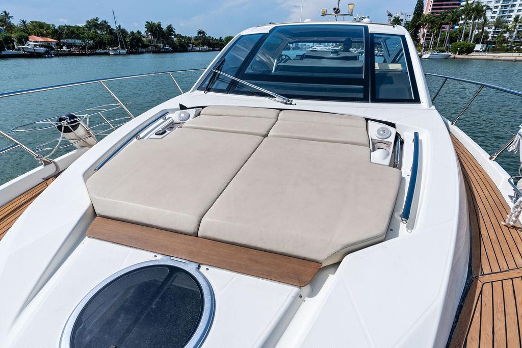 Cranchi-56 HT 2014-Minion FL-US-Cranchi 56 HT 2014 yacht with sunbathing deck, docked by a scenic waterfront.-9819548 | Thumbnail