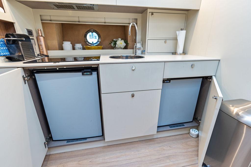 Cranchi-56 HT 2014-Minion FL-US-Modern kitchen area in 2014 Cranchi 56 HT yacht with dual fridges and sleek cabinetry.-9819548 | Thumbnail