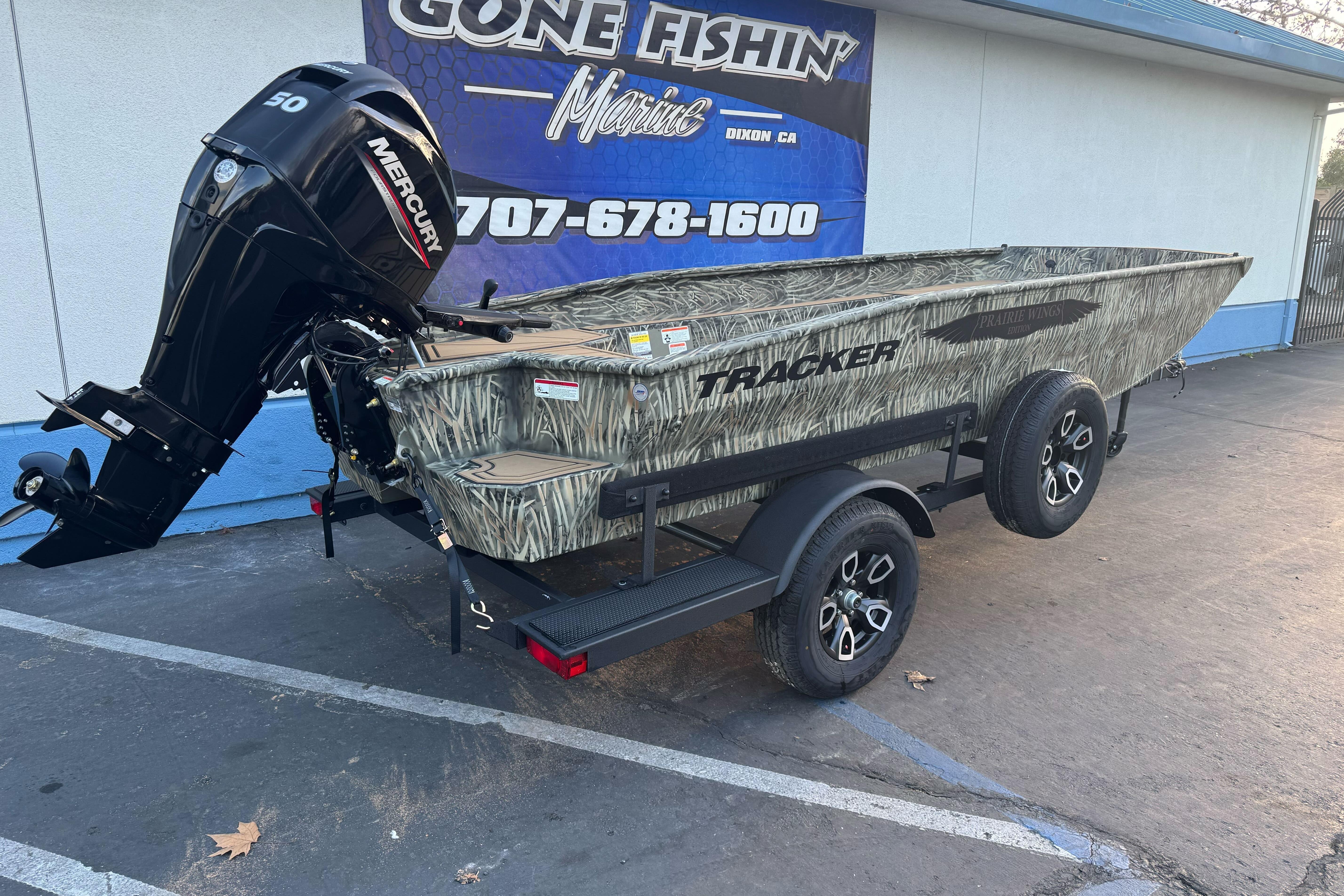 2026 Tracker Grizzly 1650 T Prairie Wings Edition boat with Mercury engine on trailer.