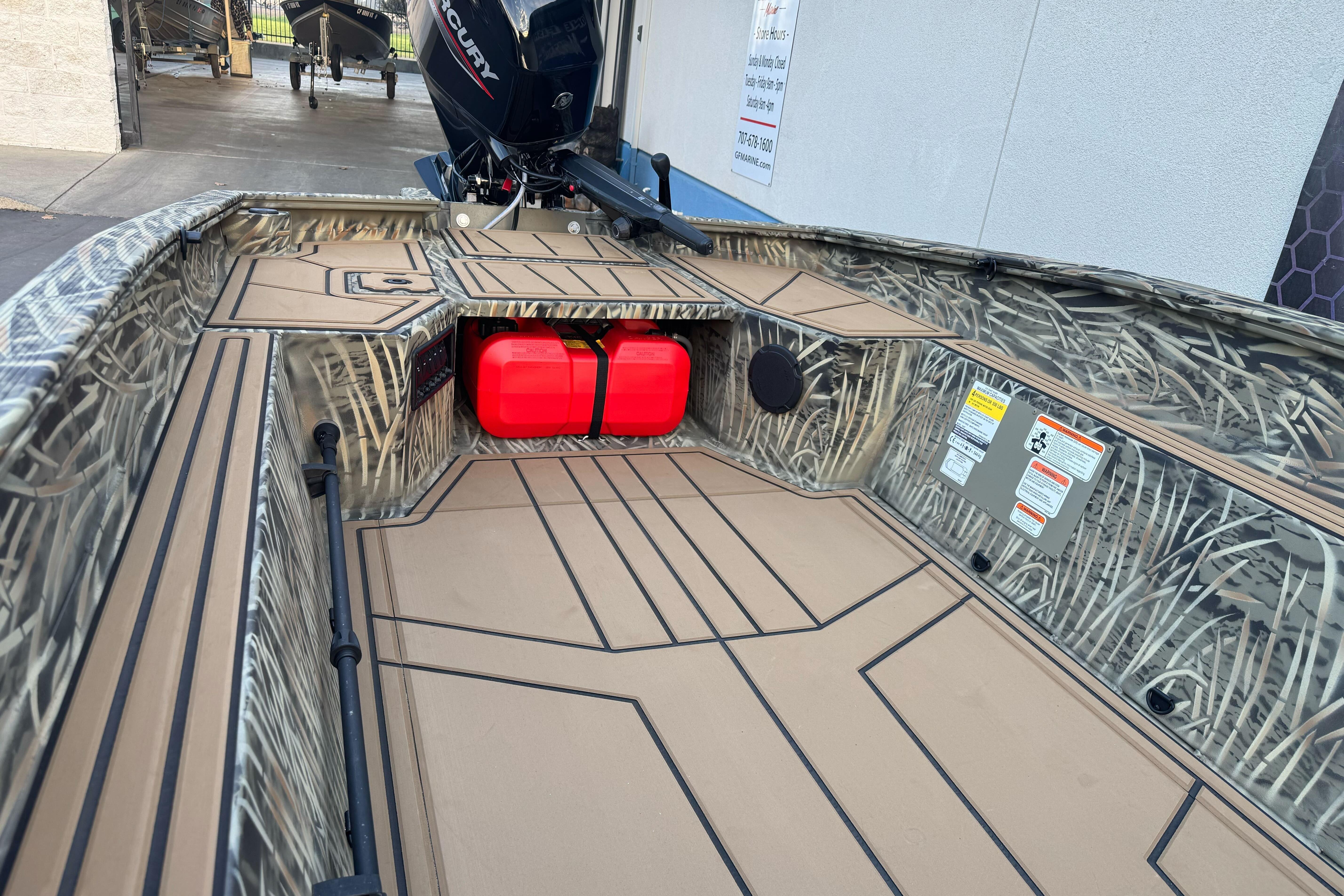2026 Tracker Grizzly 1650 T Prairie Wings Edition boat interior with camouflage design.