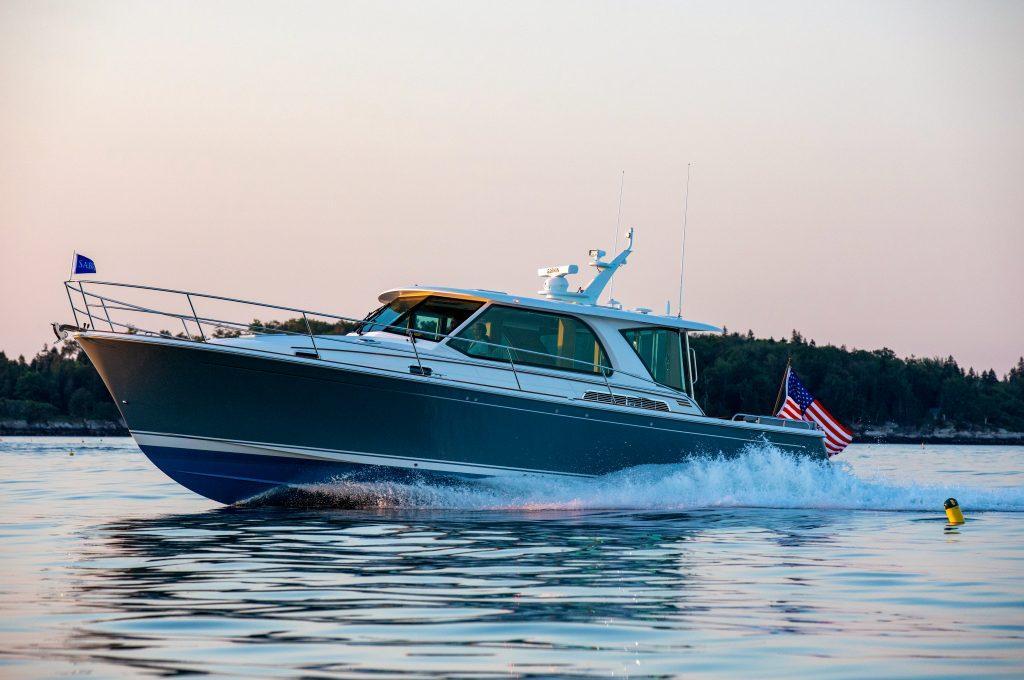 2026 Sabre 43 Salon Express cruising on calm waters at sunset.